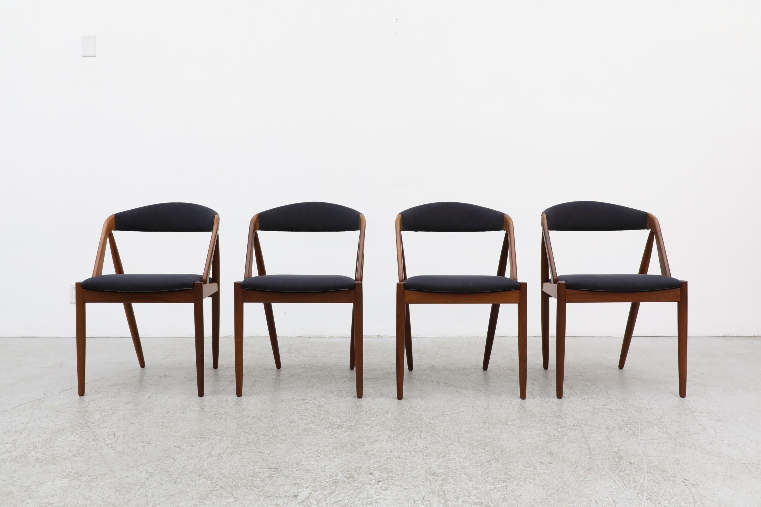 Set of 4 Kai Kristiansen 'Handy' dining chairs. Formerly known as the ‘NV31’ chair, these are in original condition with minimal wear - consistent with their age and use. Upholstered in a navy blue fabric.