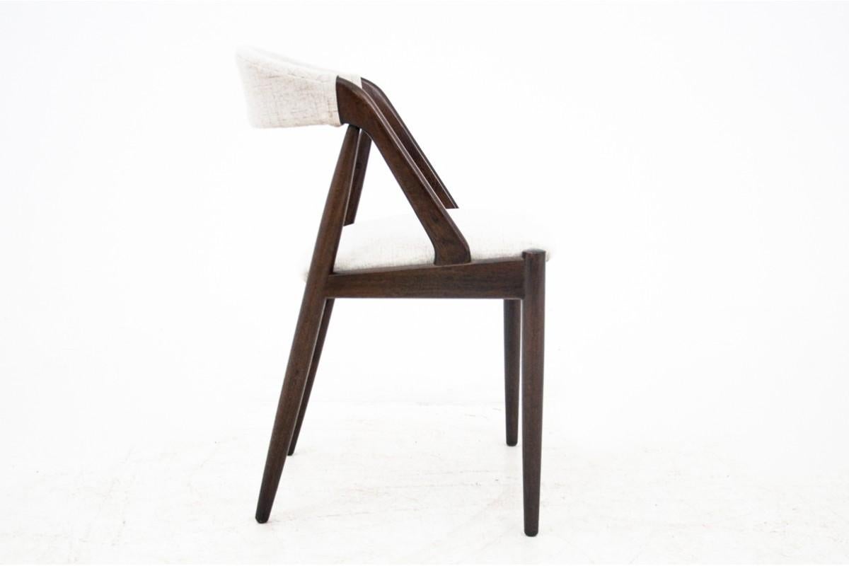 Cette paire de chaises Model 31 du célèbre designer danois Kai Kristiansen est un exemple célèbre de l'artisanat moderne du milieu du siècle. Reconnues pour leur forme élégante et sculpturale et leur confort exceptionnel, ces chaises sont dotées