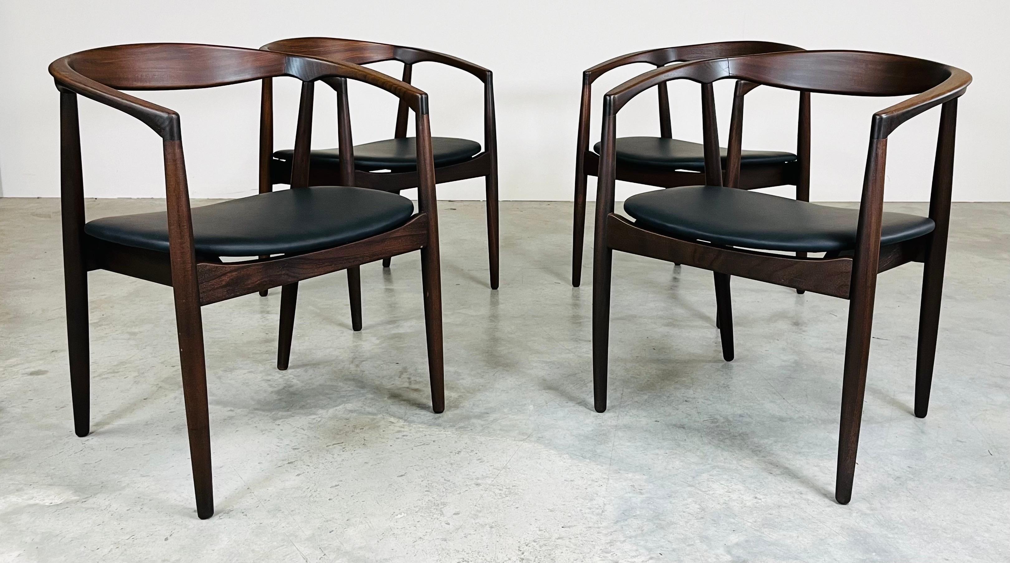 A beautiful set of 4 Kai Kristiansen 'Troja' round chairs. The frames are made from Afromosia African teak wood. Manufactured by Raymor of Denmark circa 1960. 
 In excellent condition having fresh cushioning and durable yet soft high end stain proof