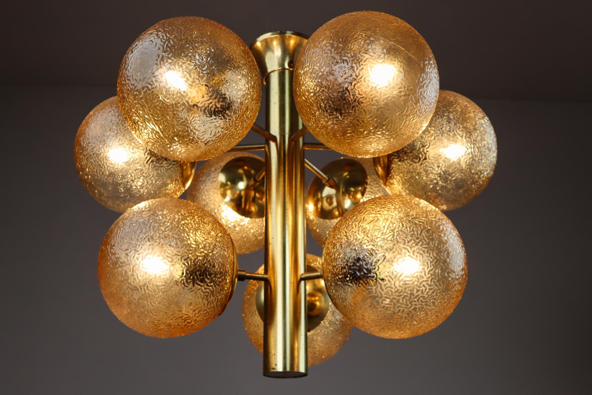Stunning set of 4 Sputnik chandeliers with 9 handmade glass globes and patinated brass by Kaiser Leuchten, Germany, 1960s.This chandelier will contribute to a luxurious character of the (hotel-bar) interior. Very good vintage condition without