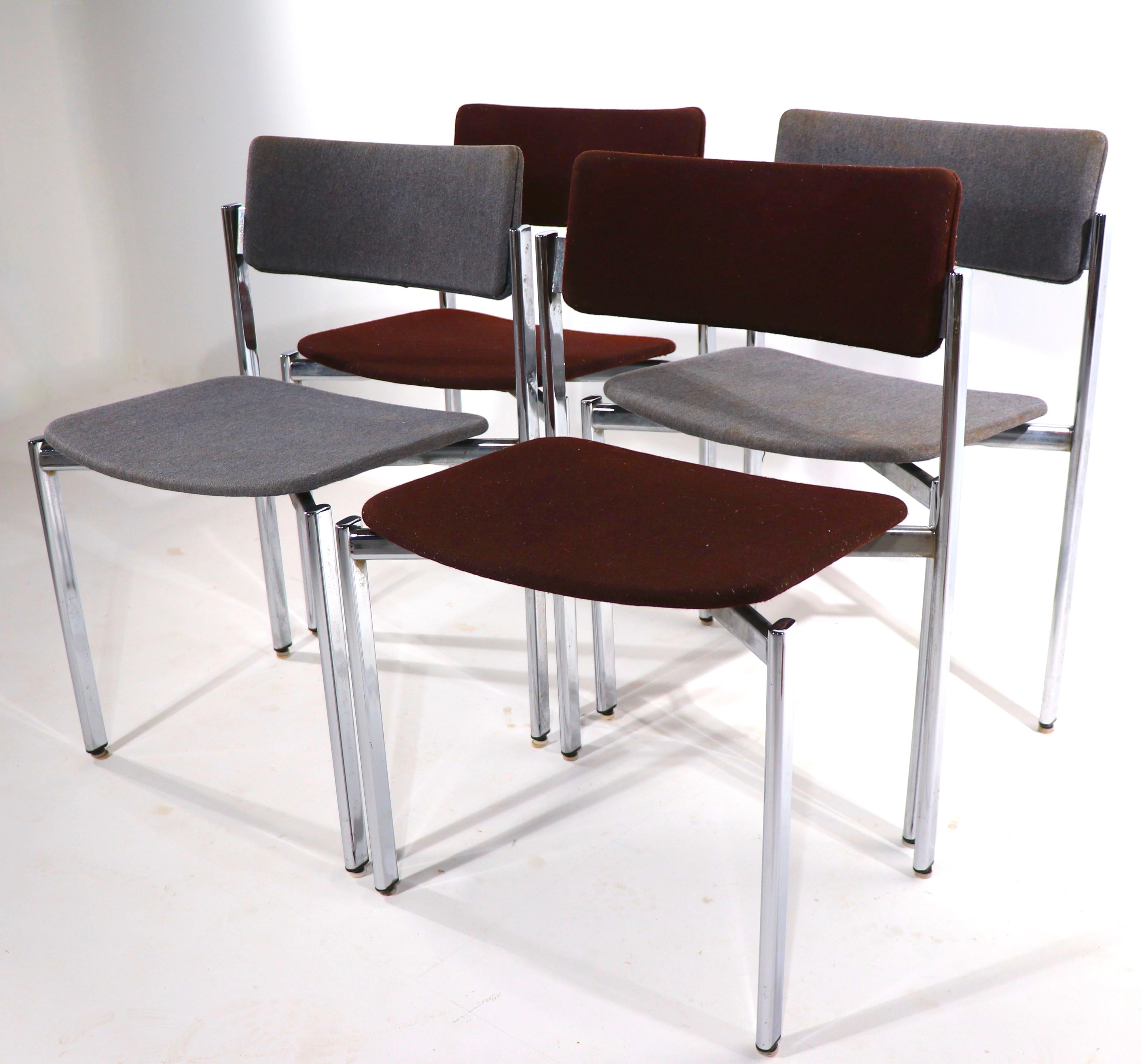 Sophisticated and chic set of four dining chairs designed by Ilmari Tapiovaara for Standing. Know as the Kiki chair, this iconic design was produced in Finland in the 1970's . These examples are structurally sound and sturdy, the chrome is bright