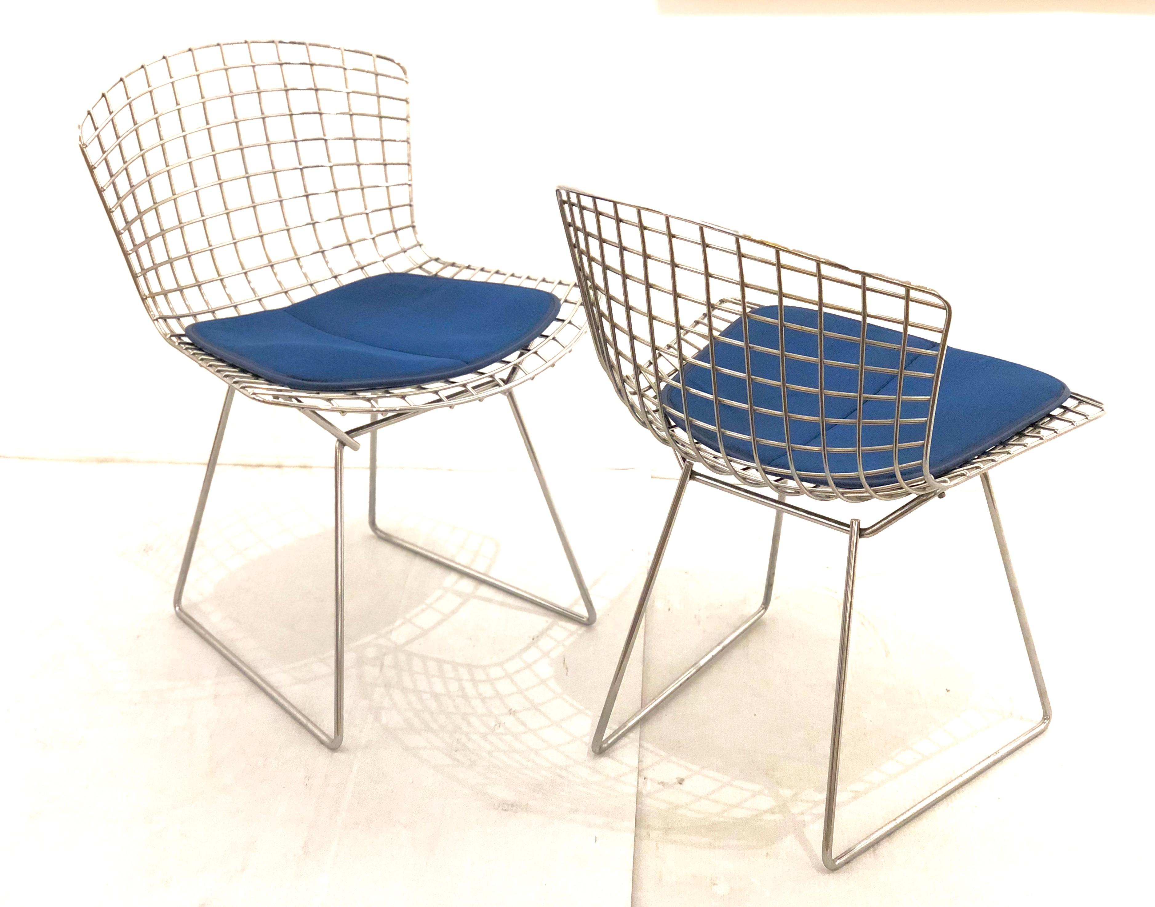 Great set of 4 chrome and cloth seat pad chairs designed by Harry Bertoia for Knoll, circa 1970s in good condition with a blue seat pad and tags in material solid and sturdy.