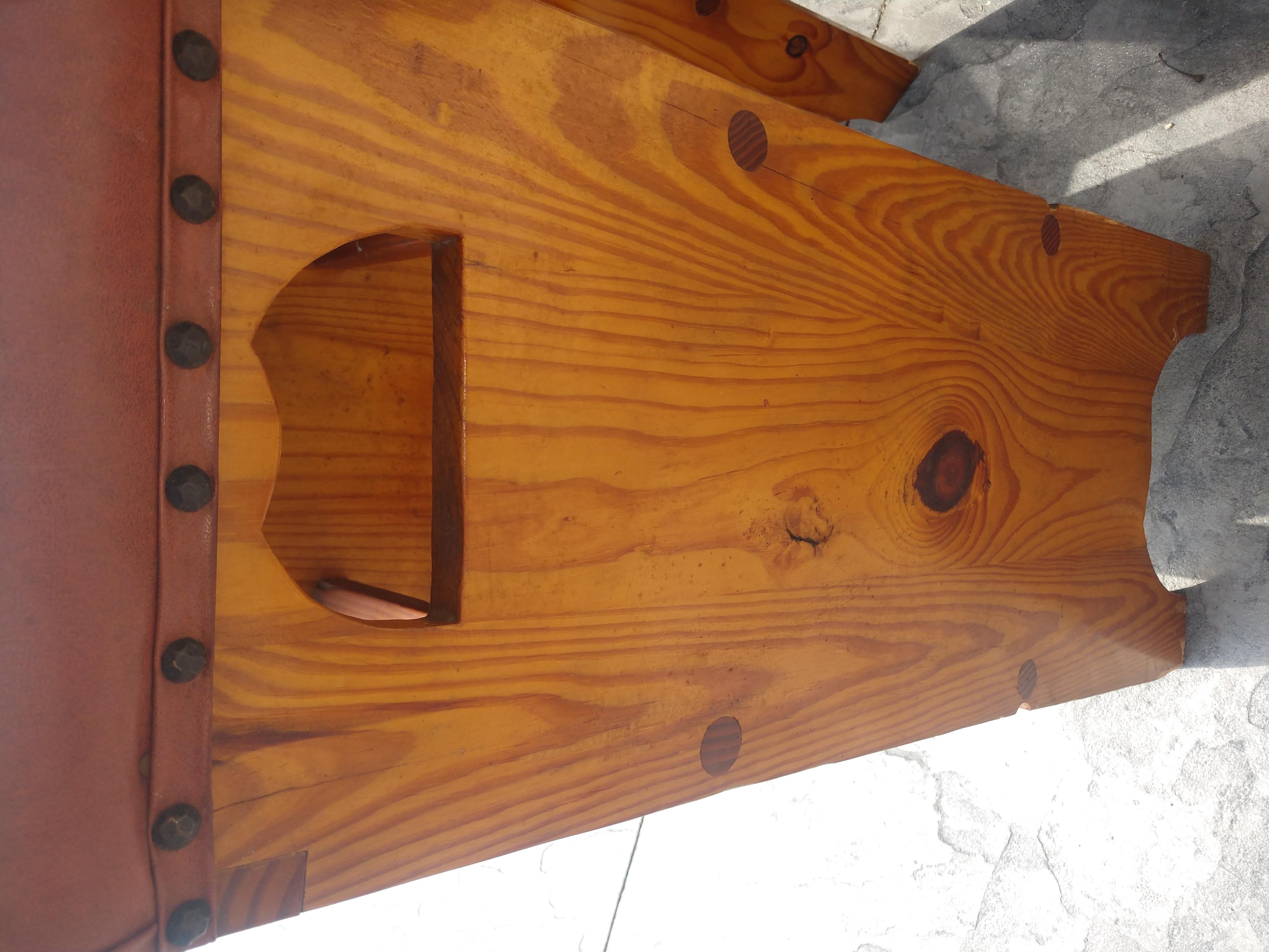 Custom made c1955 bar stools with naughahyde vinyl tops which are in need of an update. Yellow pine with fabulous contrasting wood grain with a shellac finish. Seat hgt. is 31 inches.