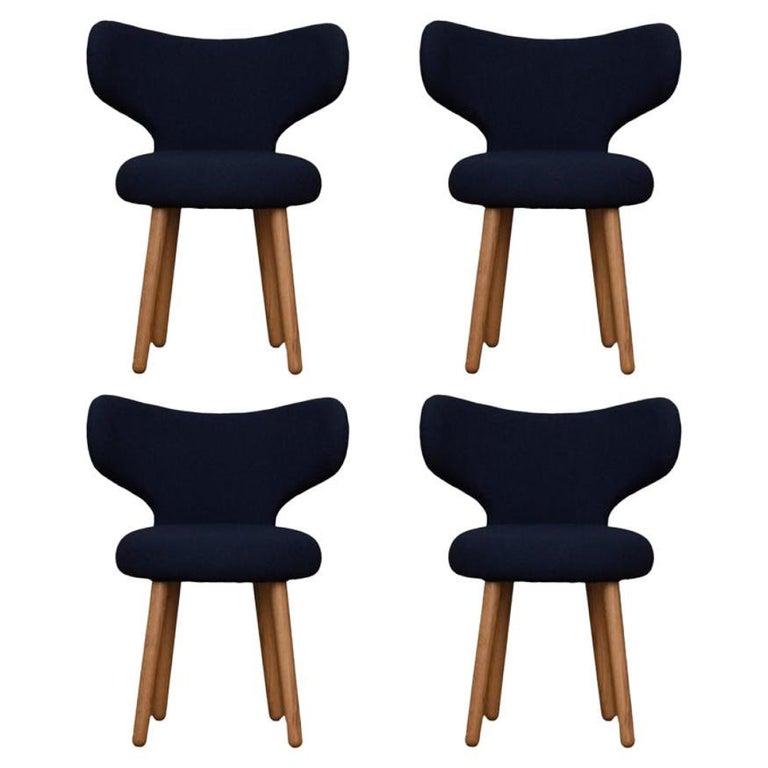 Set Of 4 KVADRAT/Hallingdal & Fiord WNG chairs by Mazo Design
Dimensions: W 60 x D 50 x H 76 cm
Materials: Oak, Textile 
Also Available: BUTE/Storr, KVADRAT/Hallingdal & Fiord, KVADRAT/ Vidar, DAW/Mcnutt, DEDAR/Artemidor, Sheepskin.
The WNG