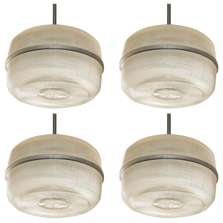 Set of 4 large molded glass industrial hanging lights at 1stdibs