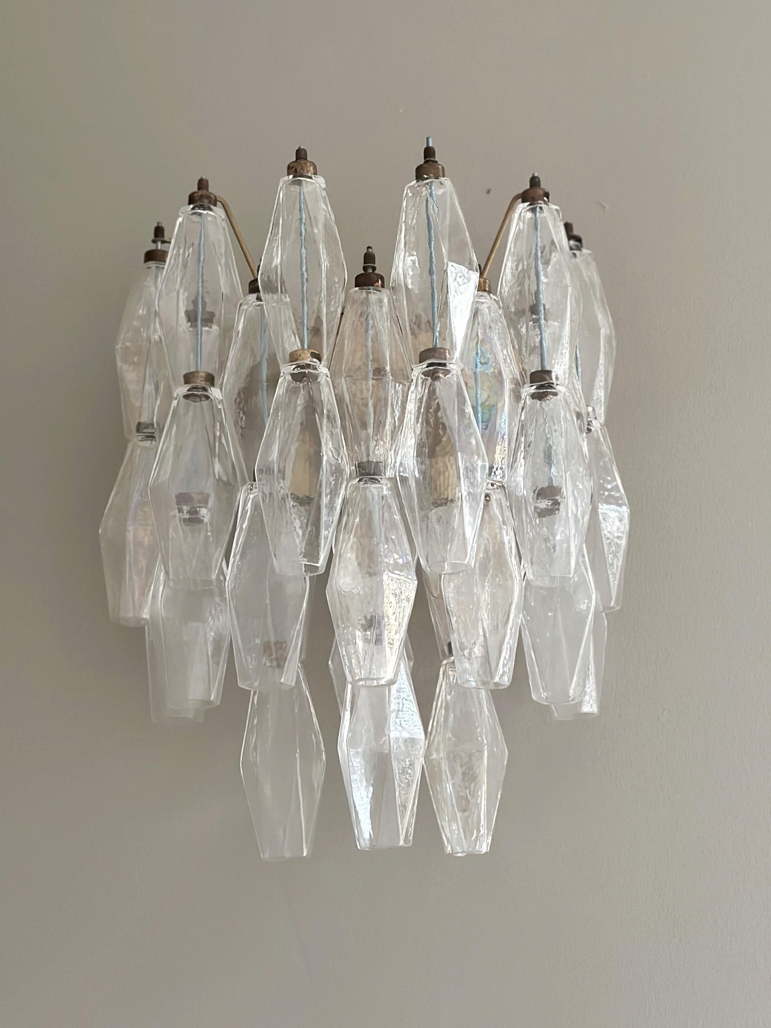 Set of 4 four Murano Wall Lamps consisting of 33 handmade crystal prisms in clear murano glass. Lamp structure of metal with fittings painted in a light brown, bronzy tone. Glass from the Italian Murano District. Traditional Italian Mid-Century
