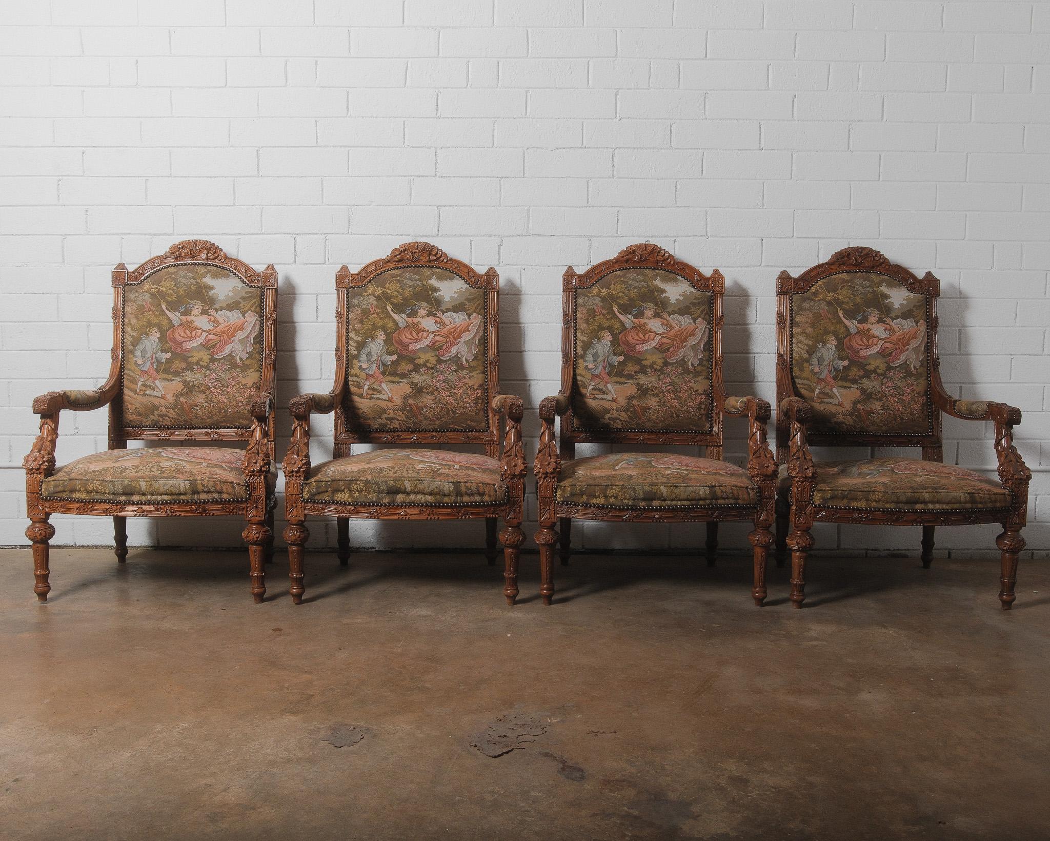 This exquisite set of French armchairs showcases the elegance of the Louis XVI Revival style, dating from the late 19th to early 20th century. Crafted from hand-carved wood, the chairs feature intricate floral and foliate carvings, including