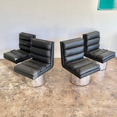 Set of 4 Leather and Chrome Swivel Dining Chairs