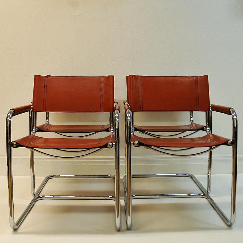 Four beautiful armchairs in dark cognac leather by designer Mart Stam for Fasem- Italy, model S33. The chairs have a cantilevered tubular metal frame with cognac leather seating and backrest. The chairs are marked with 'Fasem 6 84' . Produced 1984.