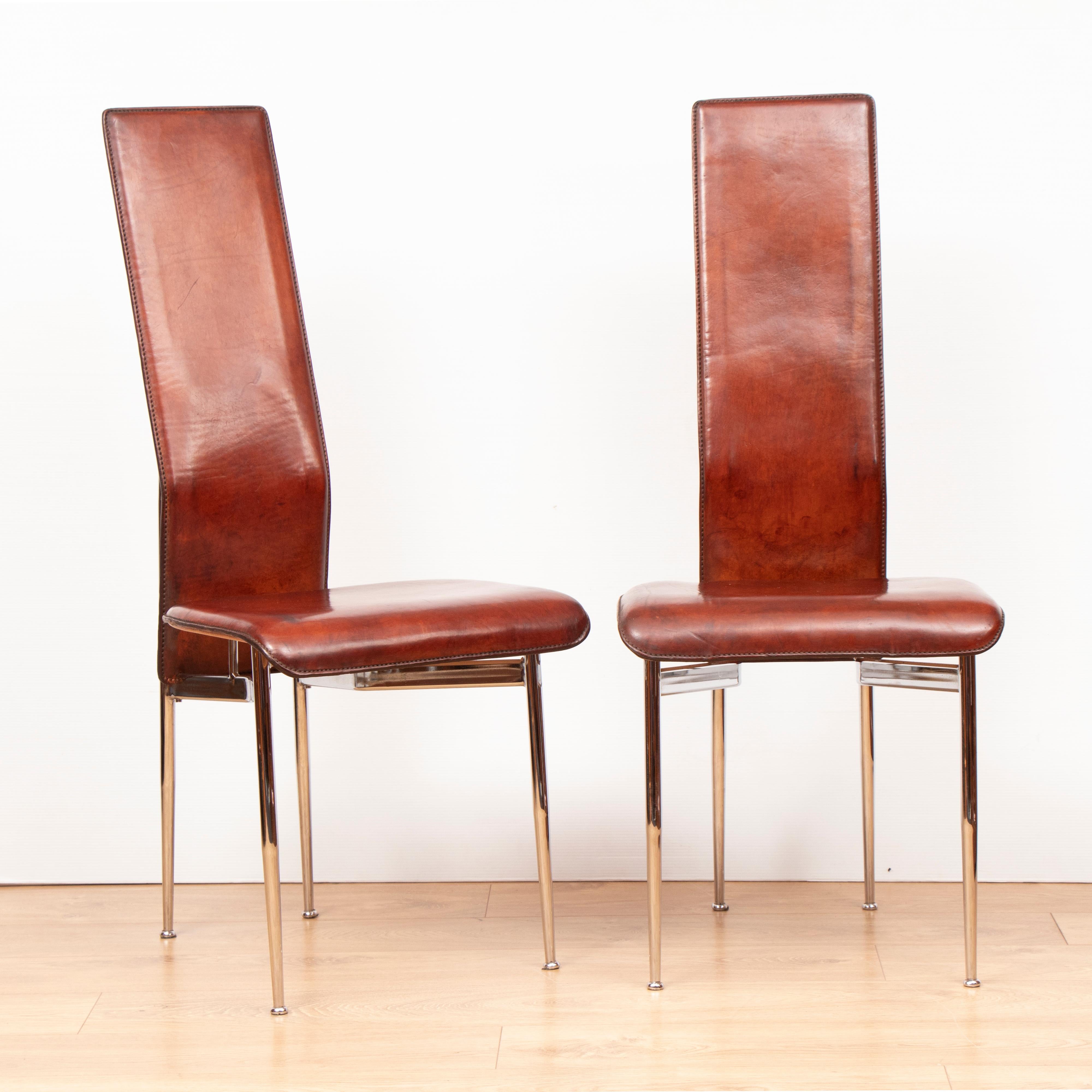 Set of 4 leather S44 dining chairs by Giancarlo Vegni for Fasem, circa 1990.
The chairs have had the bases cleaned and polished and the leather cleaned and revived naturally.

They have a warm chocolate brown vintage color.