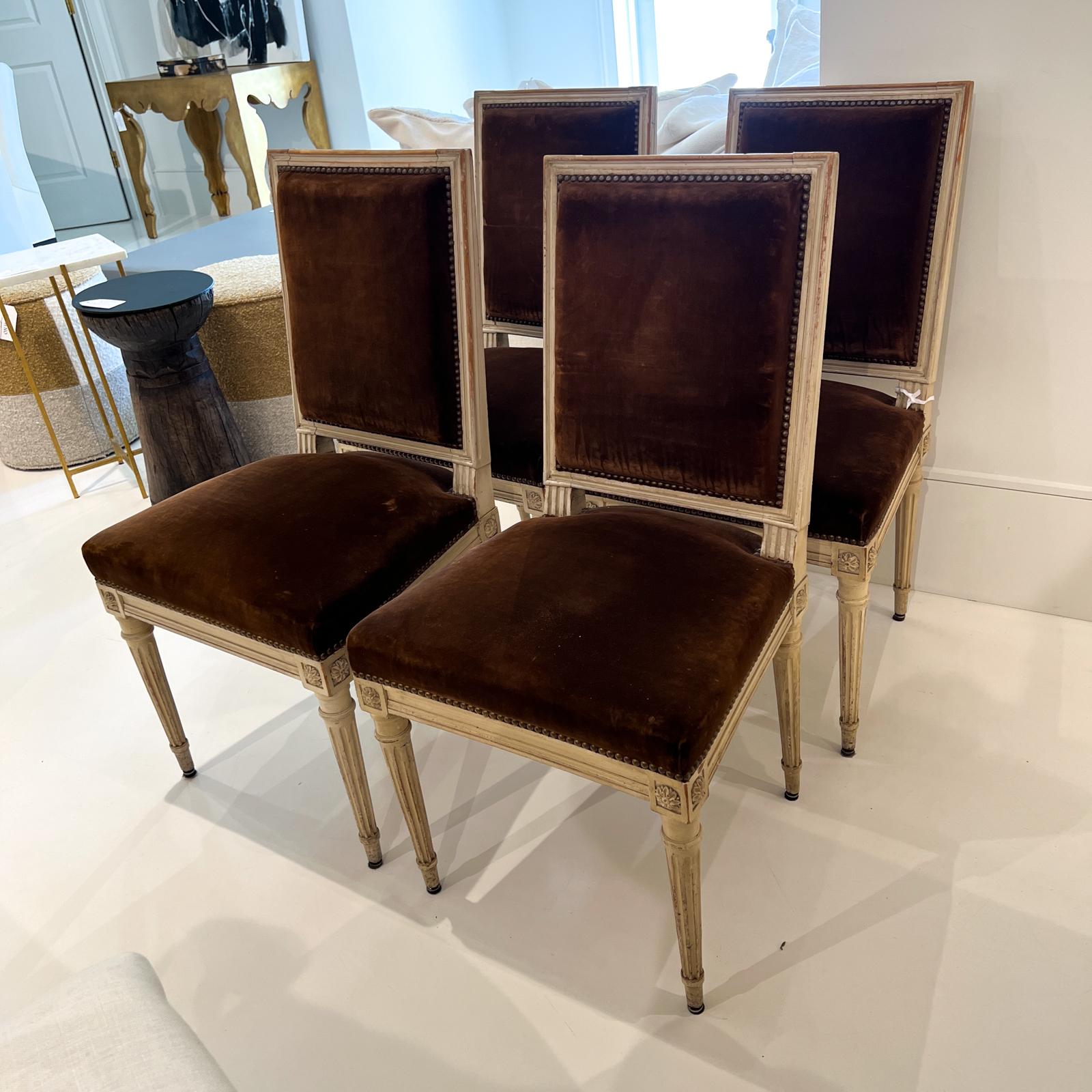 Set of four square back side chairs with beautiful tobacco colored velvet upholstery.
