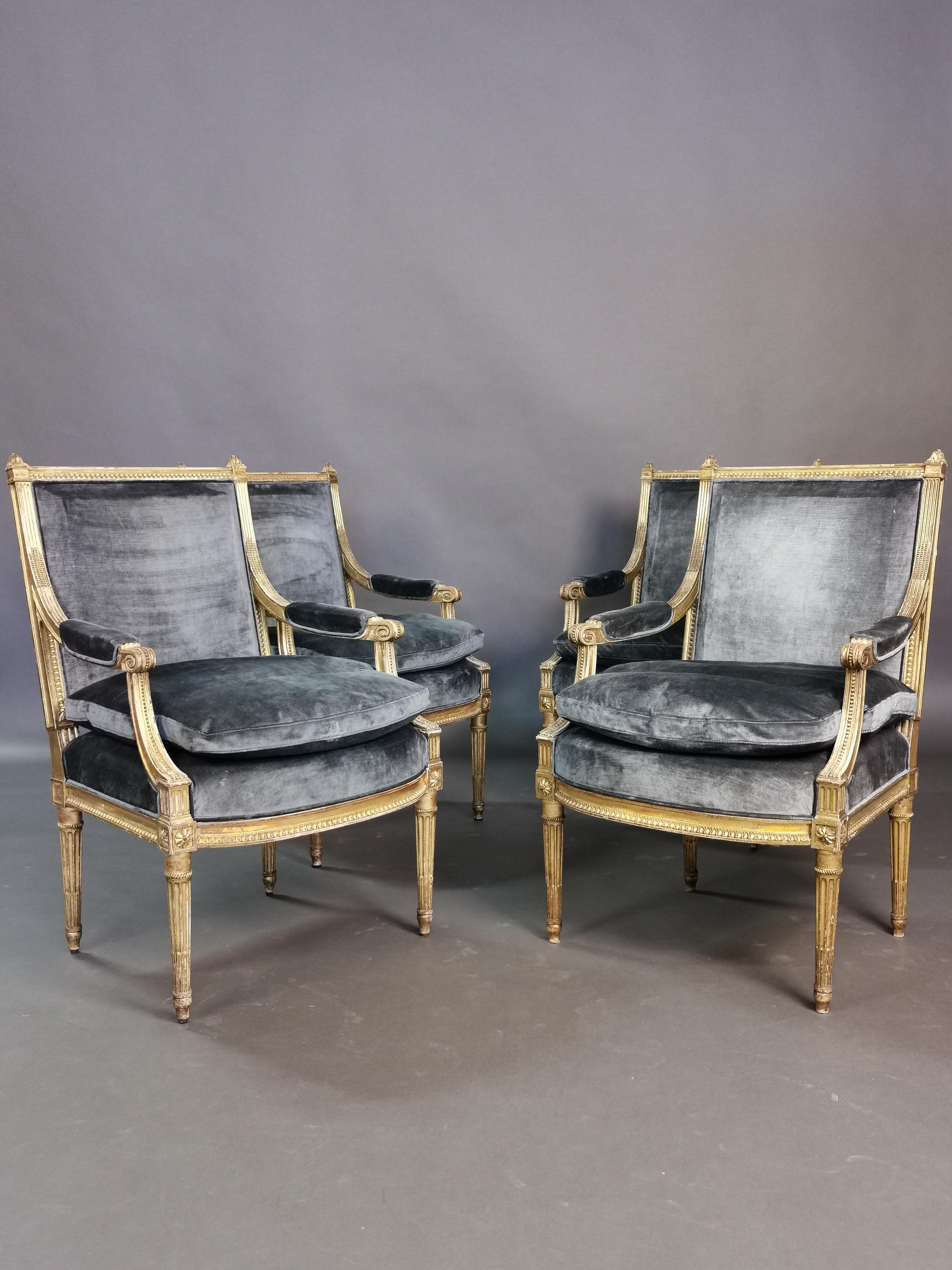 A set of 4 very comfortable 19th century Louis XVI style armchairs in the manner of Henri Jacob.
Gilded beechwood and grey velvet upholstery.
 