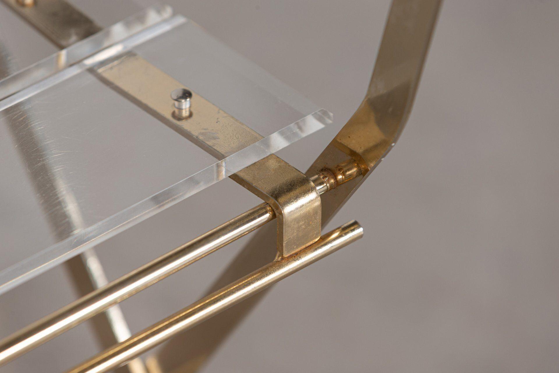 Circa 1970
Set of Four Lucite Folding Chairs Yonel Lebovici in brass plated steel and Lucite.
For Marais International, Edition du Marais.

Measures: W39 x D46 x H84cm
Seat Height of 48cm.