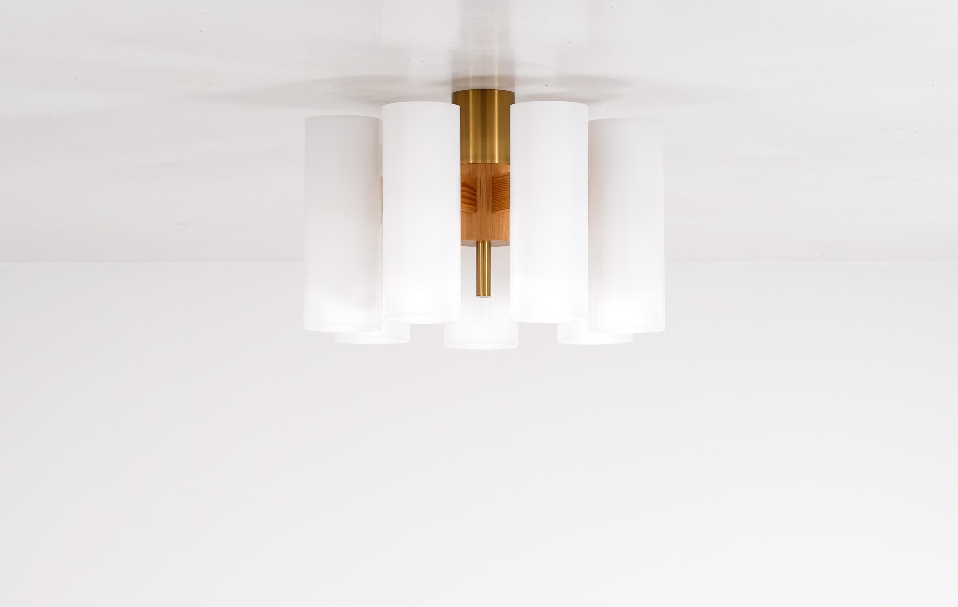 Uno & Östen Kristiansson ceiling lights produced by Luxus. Solid pine, brass and acrylic shades. 
Please note: listed price is for a single lamp.