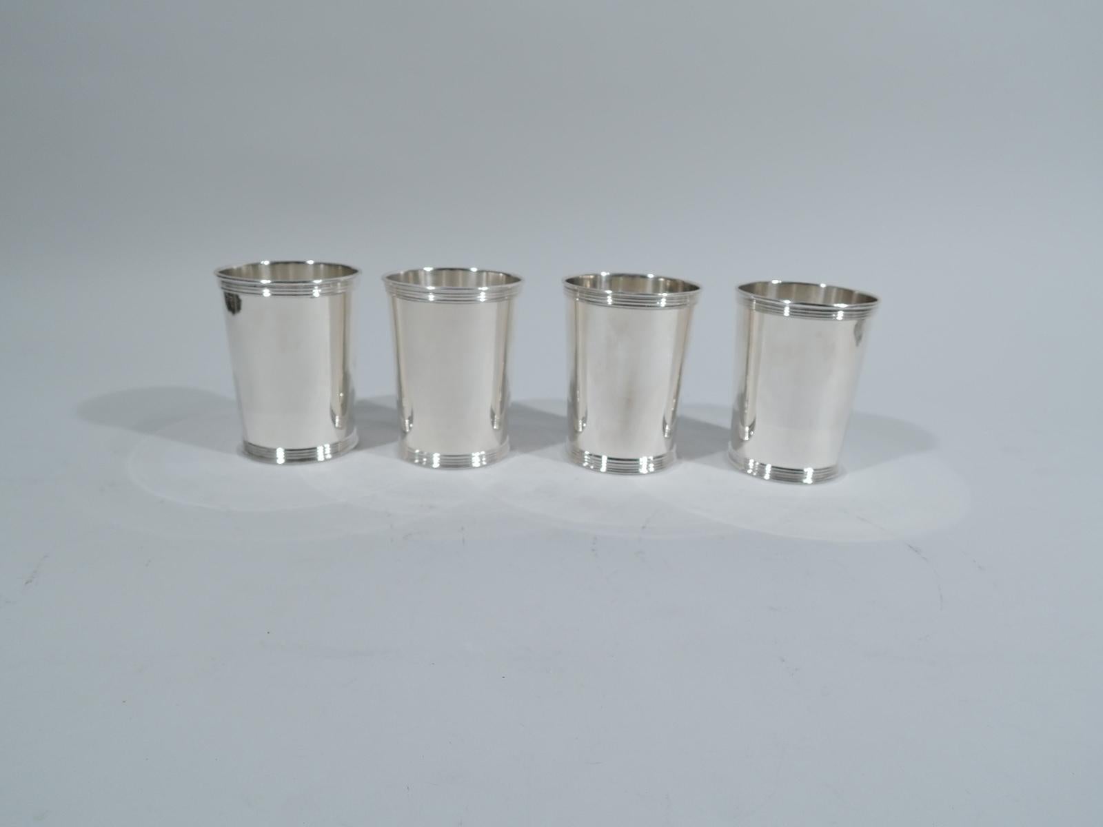Set of 4 sterling silver mint julep cups. Made by Manchester in Providence. Each: Straight and tapering sides, and reeded rim and foot. Fully marked and numbered 3759. Total weight: 15.5 troy ounces.