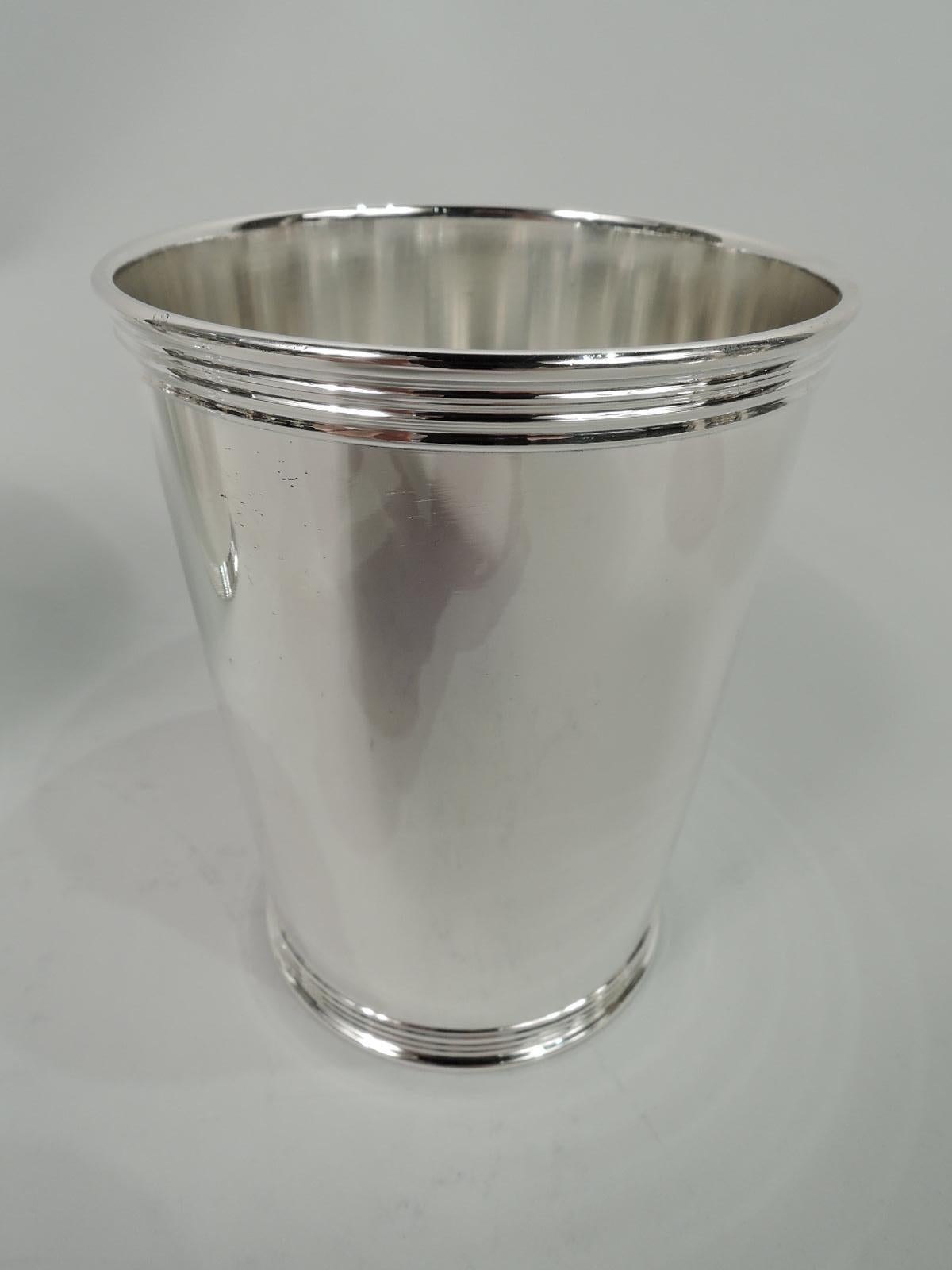 Set of 4 traditional sterling silver mint julep cups. Made by Manchester in Providence. Each: Straight and tapering sides, and reeded rim and base. A great starter set. Fully marked including maker’s stamp and no. 3759S. Total weight: 17 troy ounces.