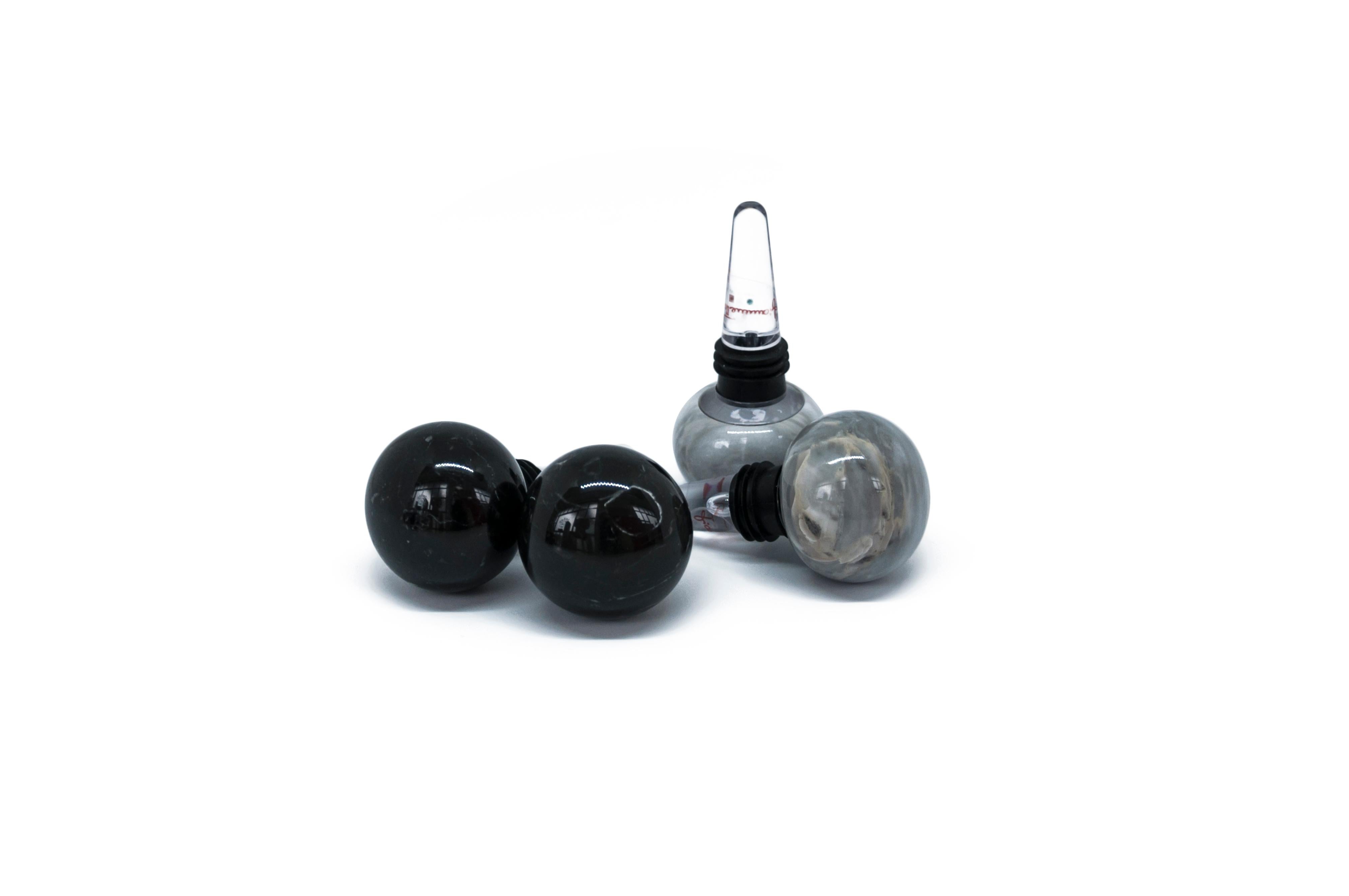 Set of 4 bottles stoppers (2 in black Marquina and 2 in grey Bardiglio marbles and plexiglas), ideal for Champagne glass bottles.

Each piece is in a way unique (since each marble block is different in veins and shades) and handcrafted in Italy.
