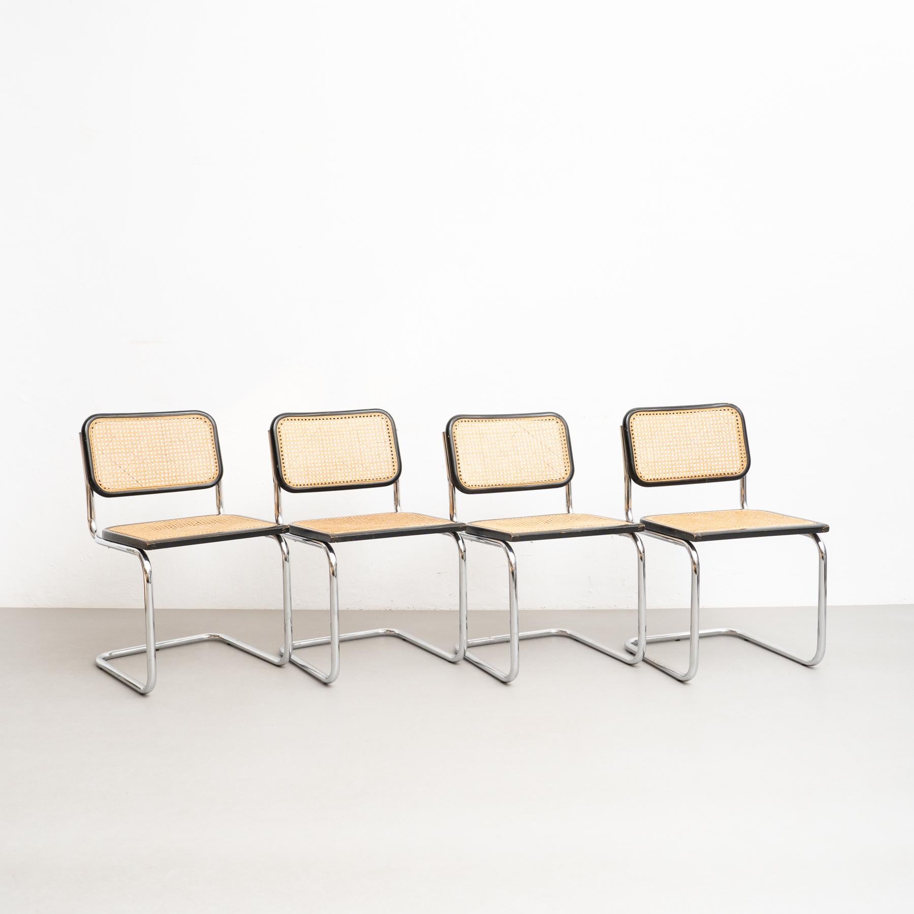 Set of 4 Cesca chairs, designed by Marcel Breuer.

Manufactured in Italy, circa 1960 by Gavina.

Metal pipe frame, wood seat and back structure and rattan.

In good original condition, with minor wear consistent with age and use, preserving a