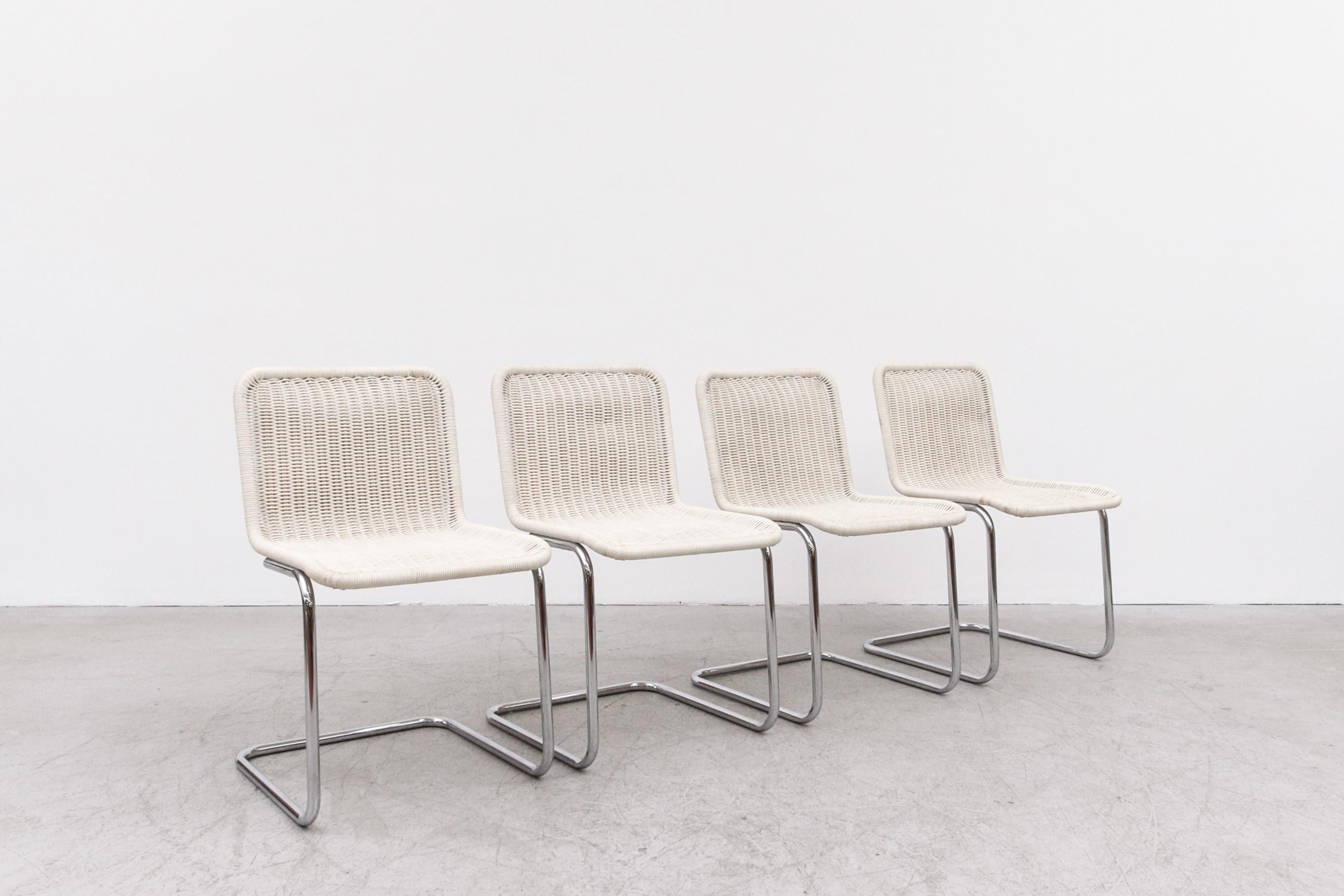 Set of 4 White Synthetic Rattan and Chrome Cantilevered side chairs. All in original condition with visible signs of wear, Including discoloration and minimal Rattan Loss. Set Price.