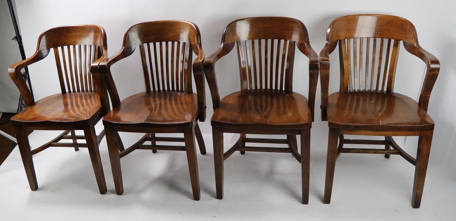 Nice group of office chairs often referred to as Yale library, or Bank of England chairs. Unusual to see matching sets offered on the market this set is in good vintage condition, sturdy and sound, all show minor cosmetic wear to the finish, normal