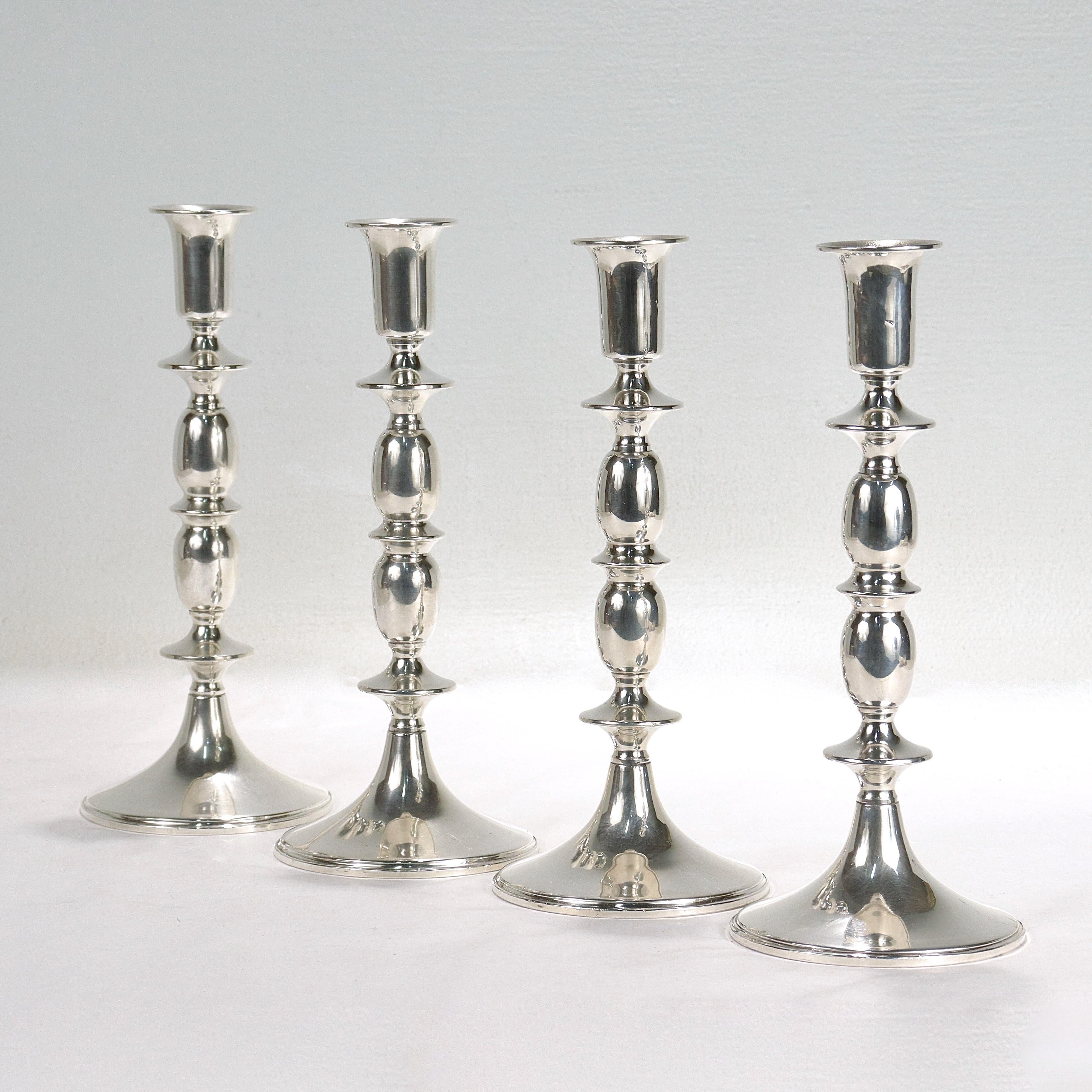 A fine set of 4 matching silver candlesticks.

In sterling silver.

By Empire.

Model no. 635.

Each with a candlecup supported by a 