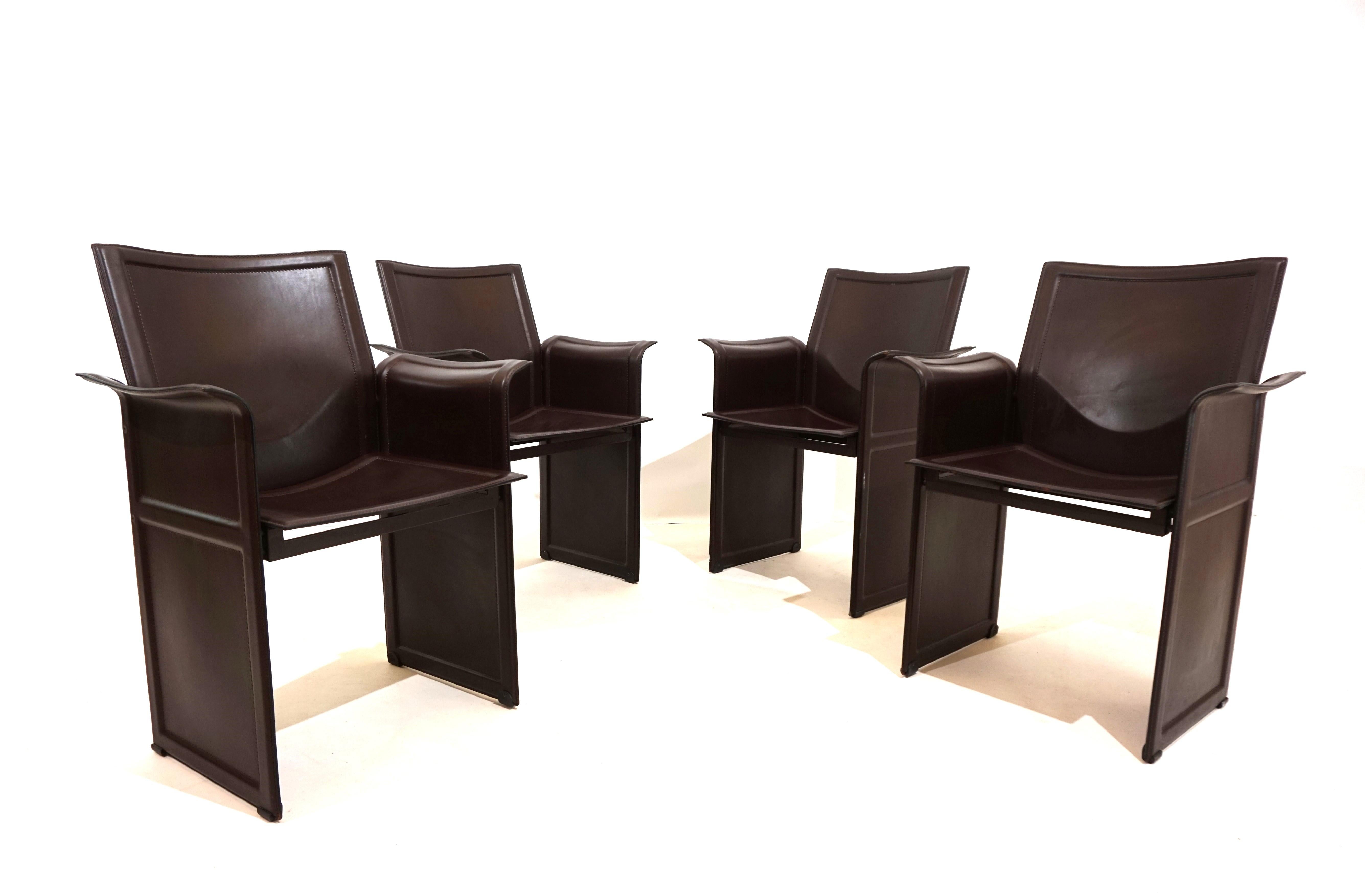 The set of 4 Matteo Grassi dining chairs made of thick brown saddle leather in typical Italian leather art.  The chairs come in an excellent,  Almost new, condition. The seats and backrests show almost signs of wear, and the floor area also has no