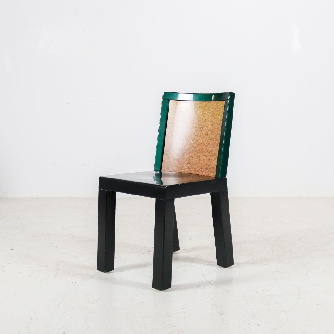 A set of four very rare 'Donau' chairs by Ettore Sottsass & Marco Zanini for Franz Leitner, Austria, 1980s. The wooden chairs are metallic green/anthracite and the back is made of burl wood veneer. A typical, post-modern 1980s eye-catcher in the