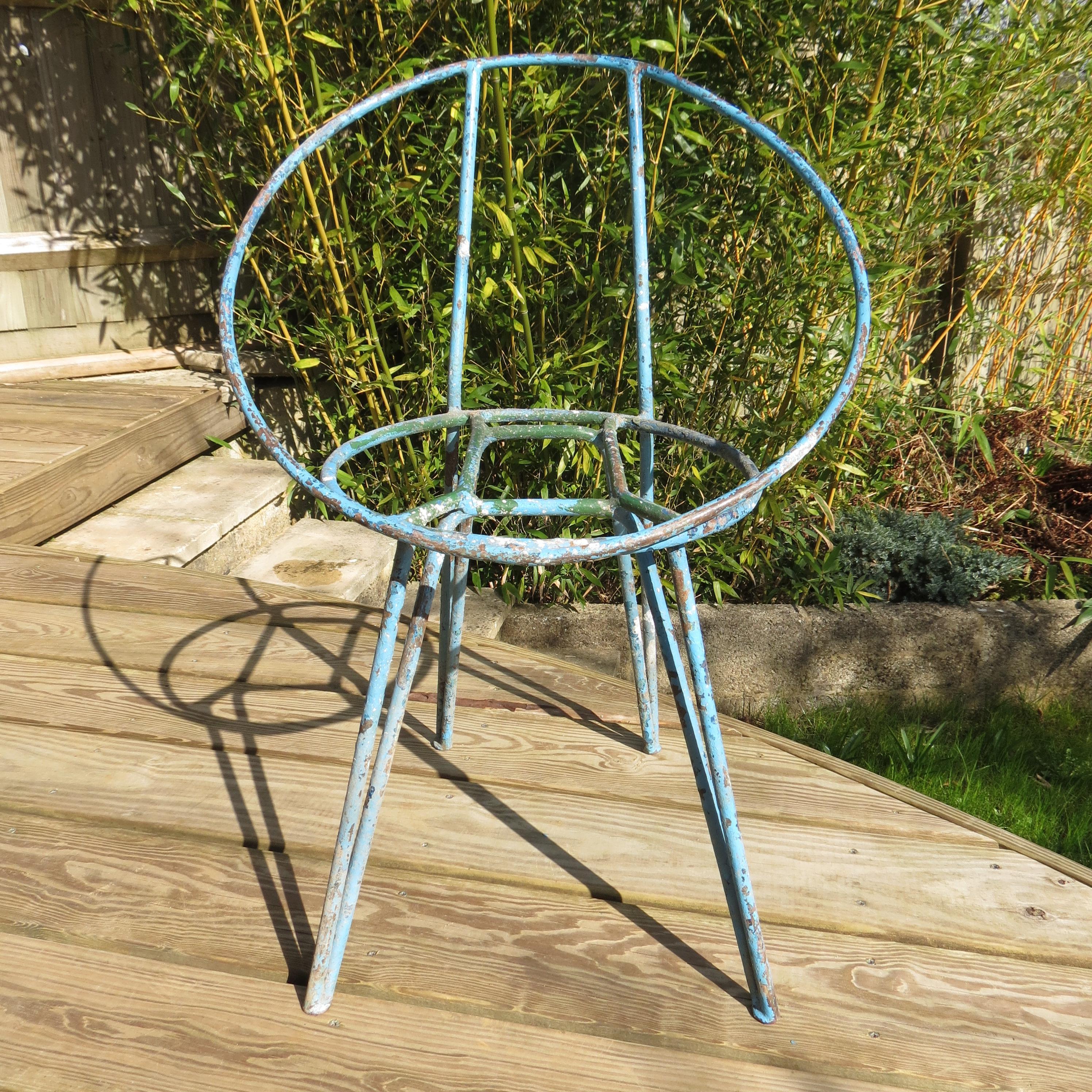 Set of 4 garden chairs made from steel rod, heavily painted, with various coats and colors over the years. Wonderfully patinated with loss of paint, revealing several layers of different colors of paint, this adds to their over all appeal.

These
