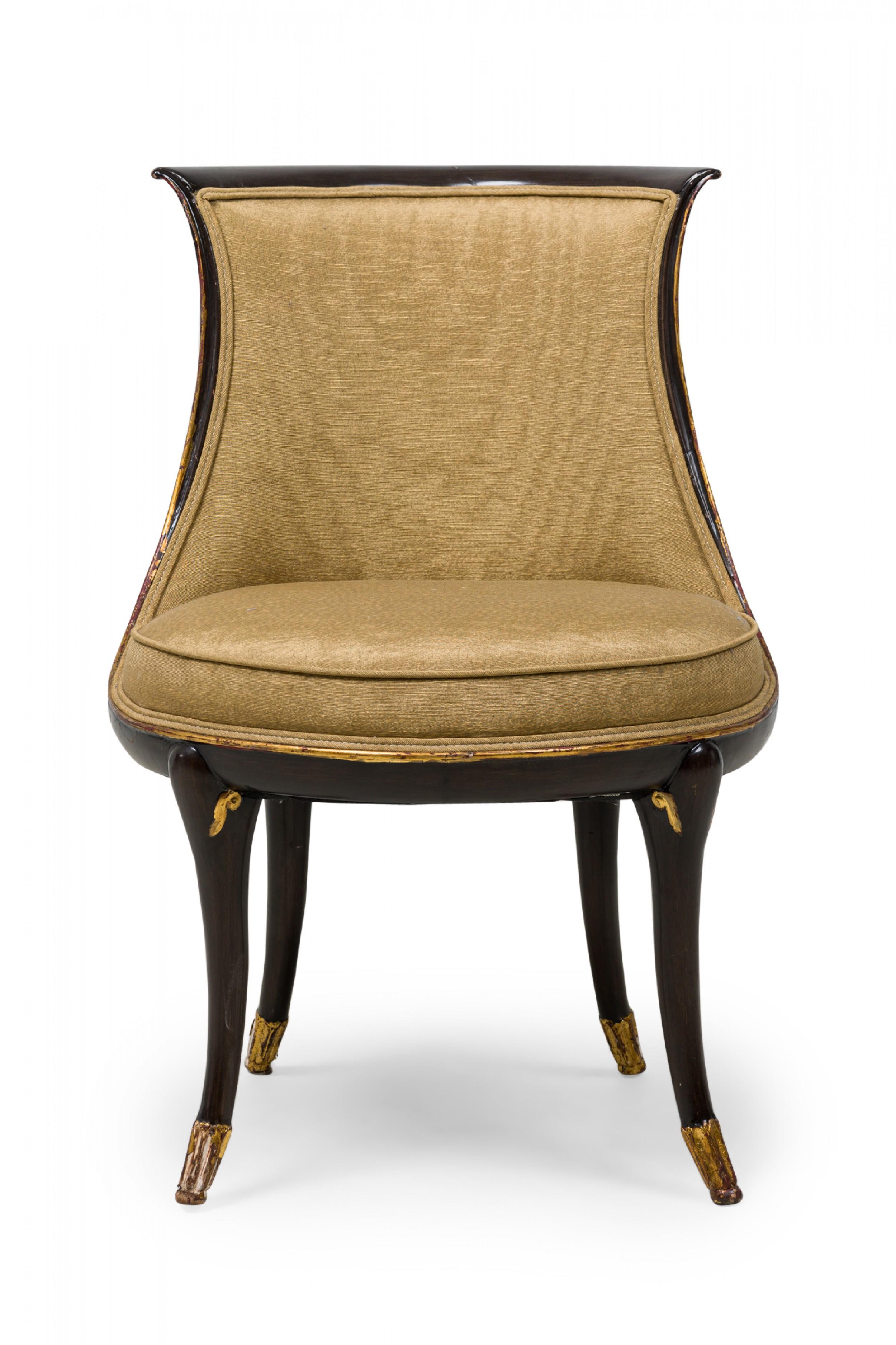 SET of 4 midcentury (1950s) American walnut painted and parcel-gilt dining chairs with concave tapered backs inlaid with a parallel brass double border, upholstered in a beige and gold fabric, the splayed legs topped by decorative gilt-highlighted,