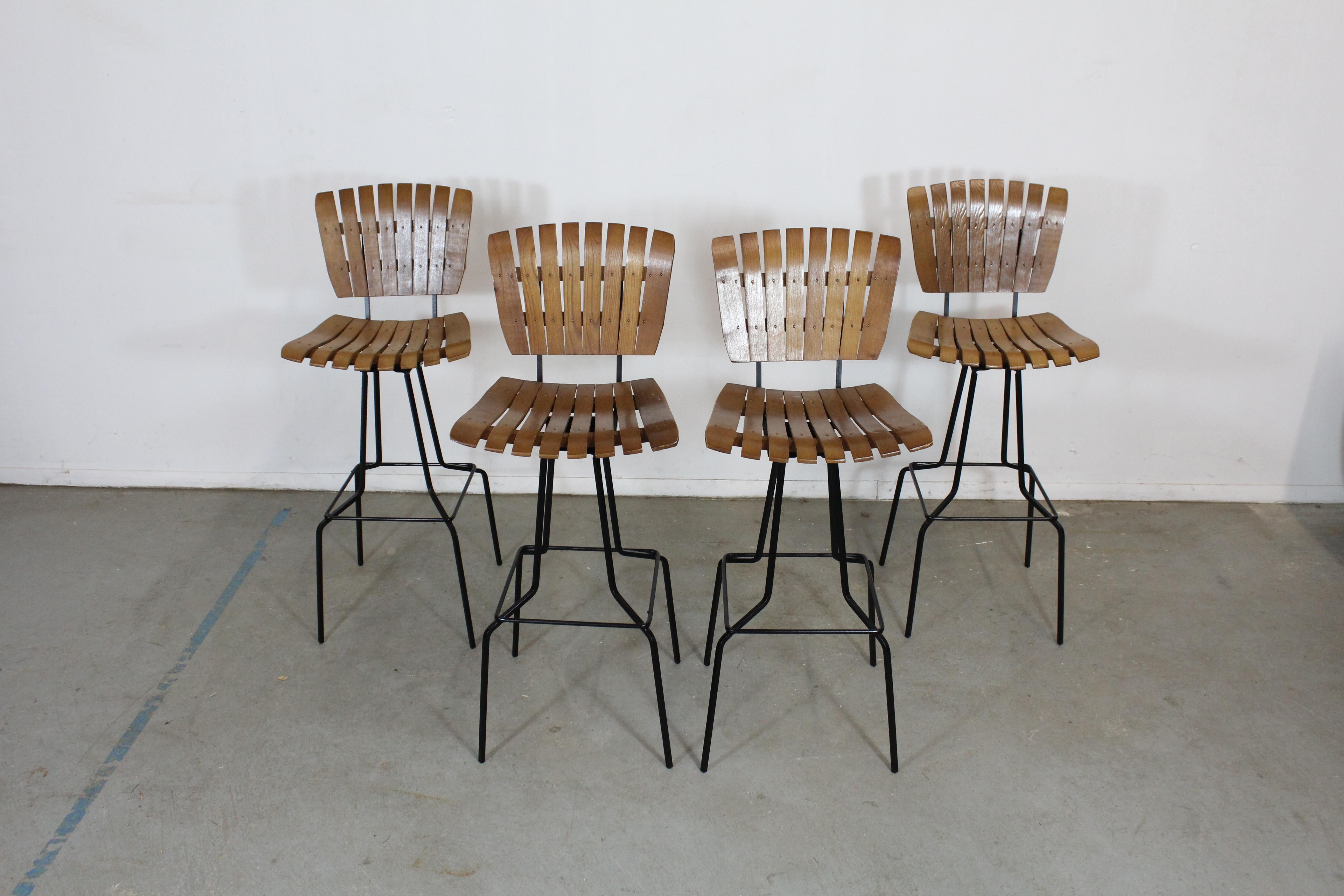Set of 4 mid-century Arthur Umanoff slat style bar stools

Offered is a great set of 4 mid-century Arthur Umanoff slat style bar stools. They have the simple lines and design seen in this time period. They are in good condition for their age