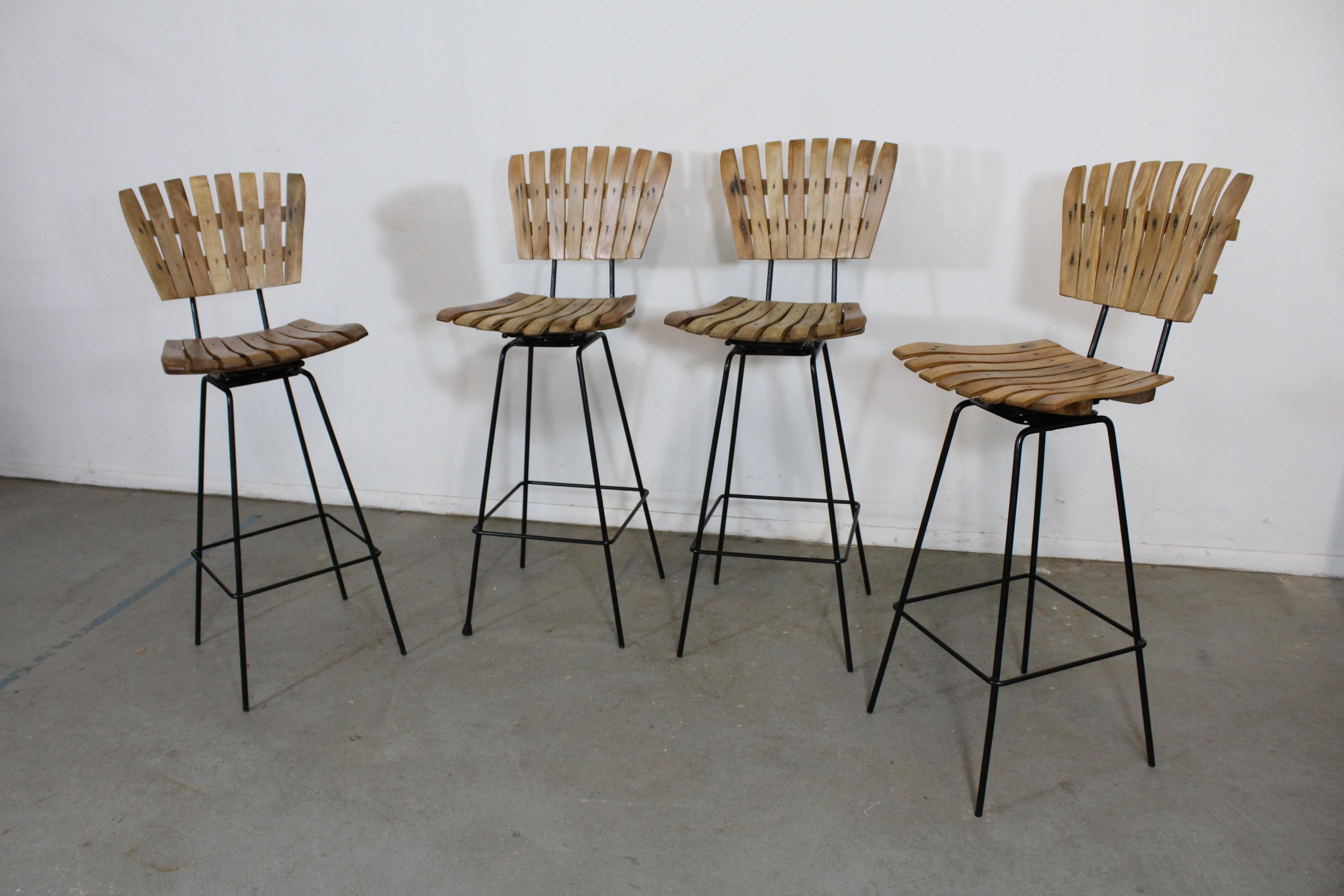 Set of 4 mid-century Arthur Umanoff slat style bar stools

Offered is a great set of 4 mid-century Arthur Umanoff slat style bar stools. They have the simple lines and design seen in this time period. They are in good condition for their age