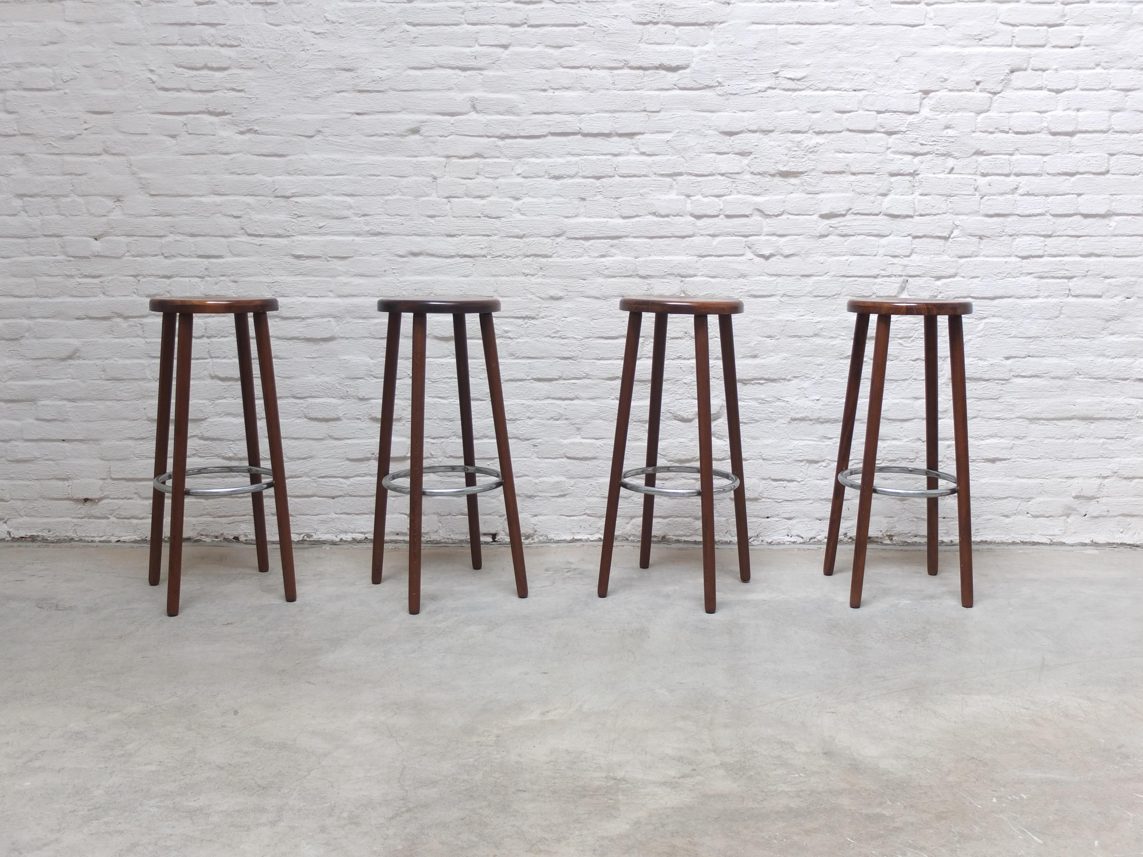 A lovely set of of 4 bar stools produced in Denmark during the 1960s. Very well-crafted elegant design and made of solid teak with a metal ring-shaped footrest. It’s not often we come across nice bar stools but this set stands out thanks to the