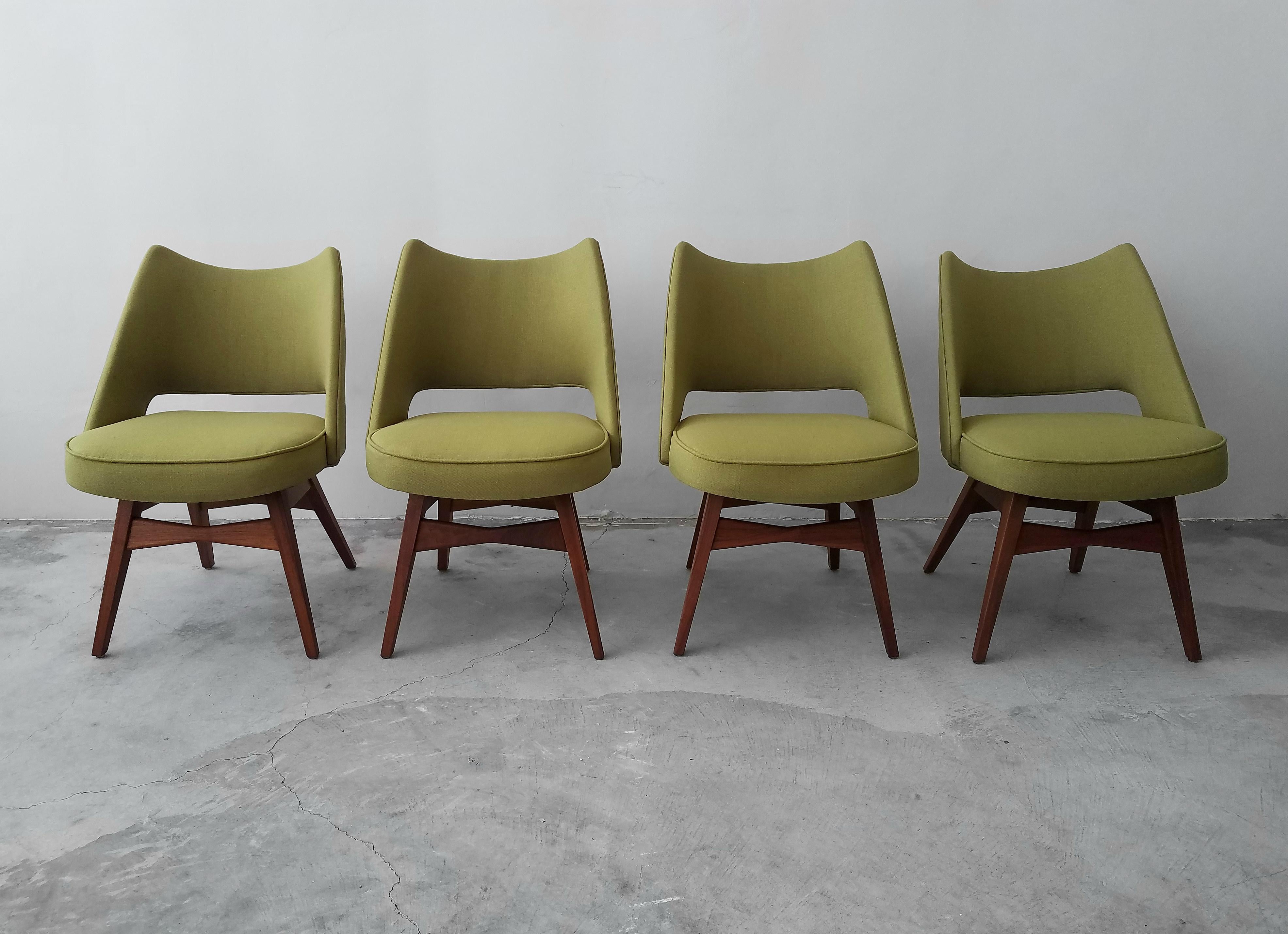 Gorgeous set of 4 midcentury walnut chairs.

Chairs have been freshly reupholstered. Ready for it's their next 60 years.