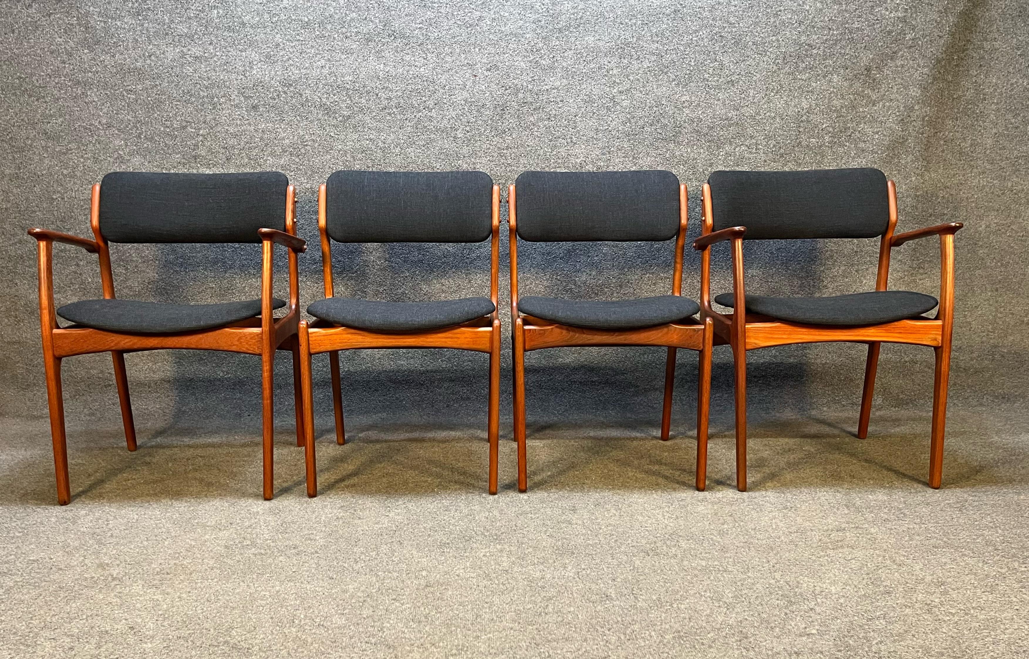 Here's is an amazing set of 4 of the quintessential Danish teak dining chairs designed by Erik Buch Model 49 and 50. These chairs have been completed refinished and have brand new charcoal black fabric and foam. This set comes with 2 captains chairs