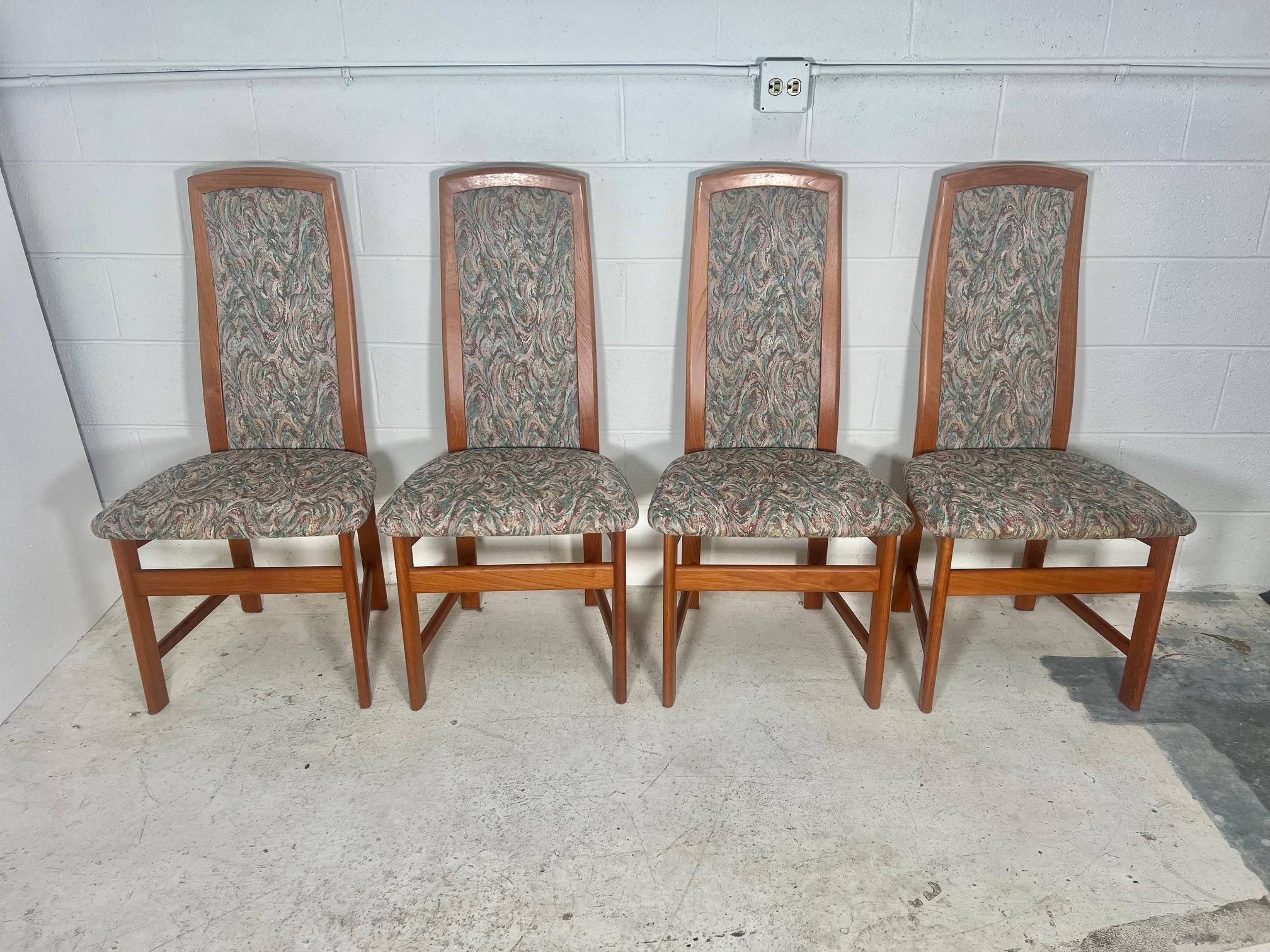 Beautiful set of 4 mid century Danish Modern teak dining chairs with padded fabric back. Made by Nordic Furniture, Markdale Ontario Canada. Stamped underneath.

Very good condition. All the chairs are very sturdy. Upholstery appears to be original.