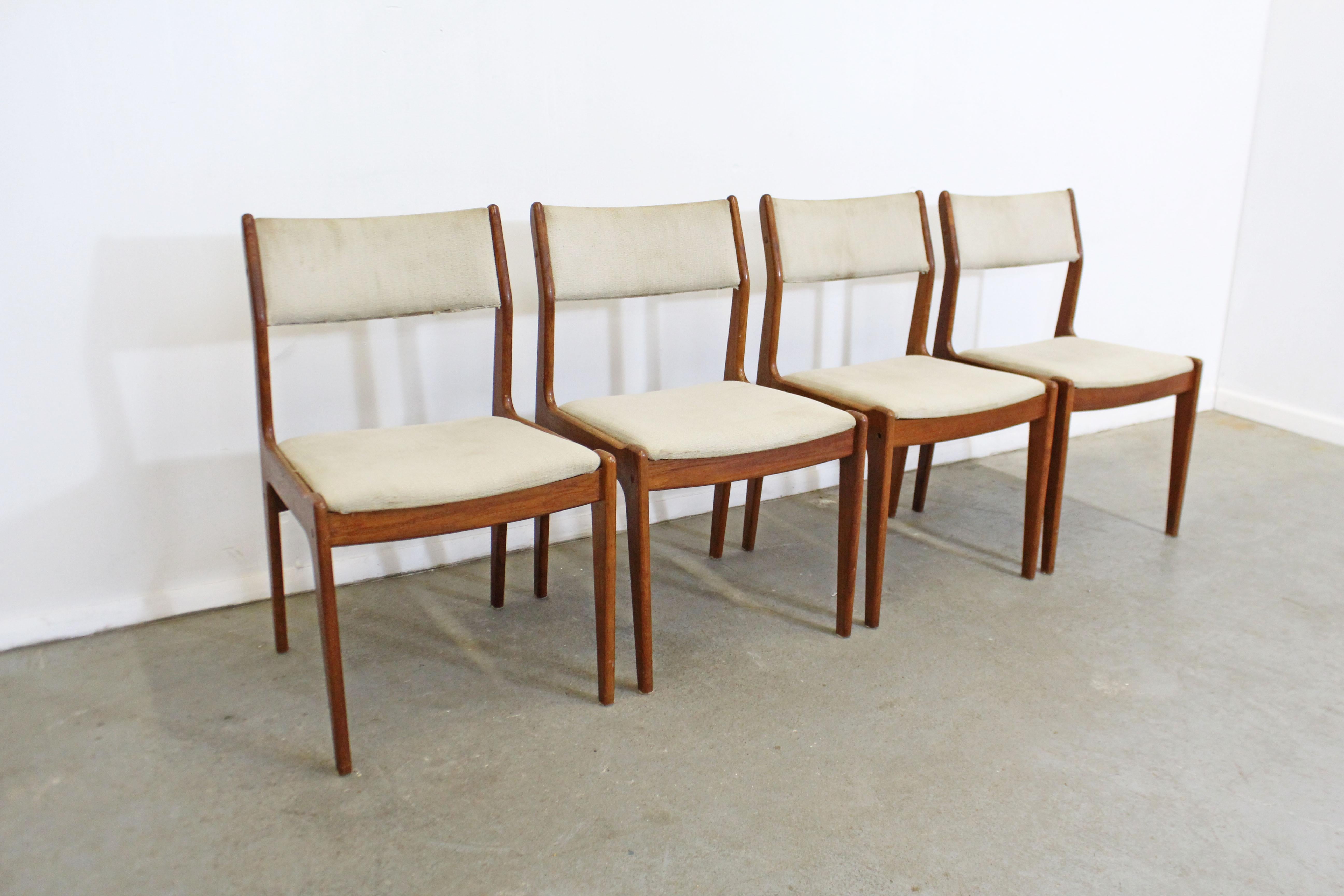 What a find. Offered is a vintage set of 4 Danish modern dining chairs made of teak. These chairs have sleek lines and have a lot of potential. They show obvious wear and need to be re-upholstered. They are not signed. 

Dimensions :
19.5
