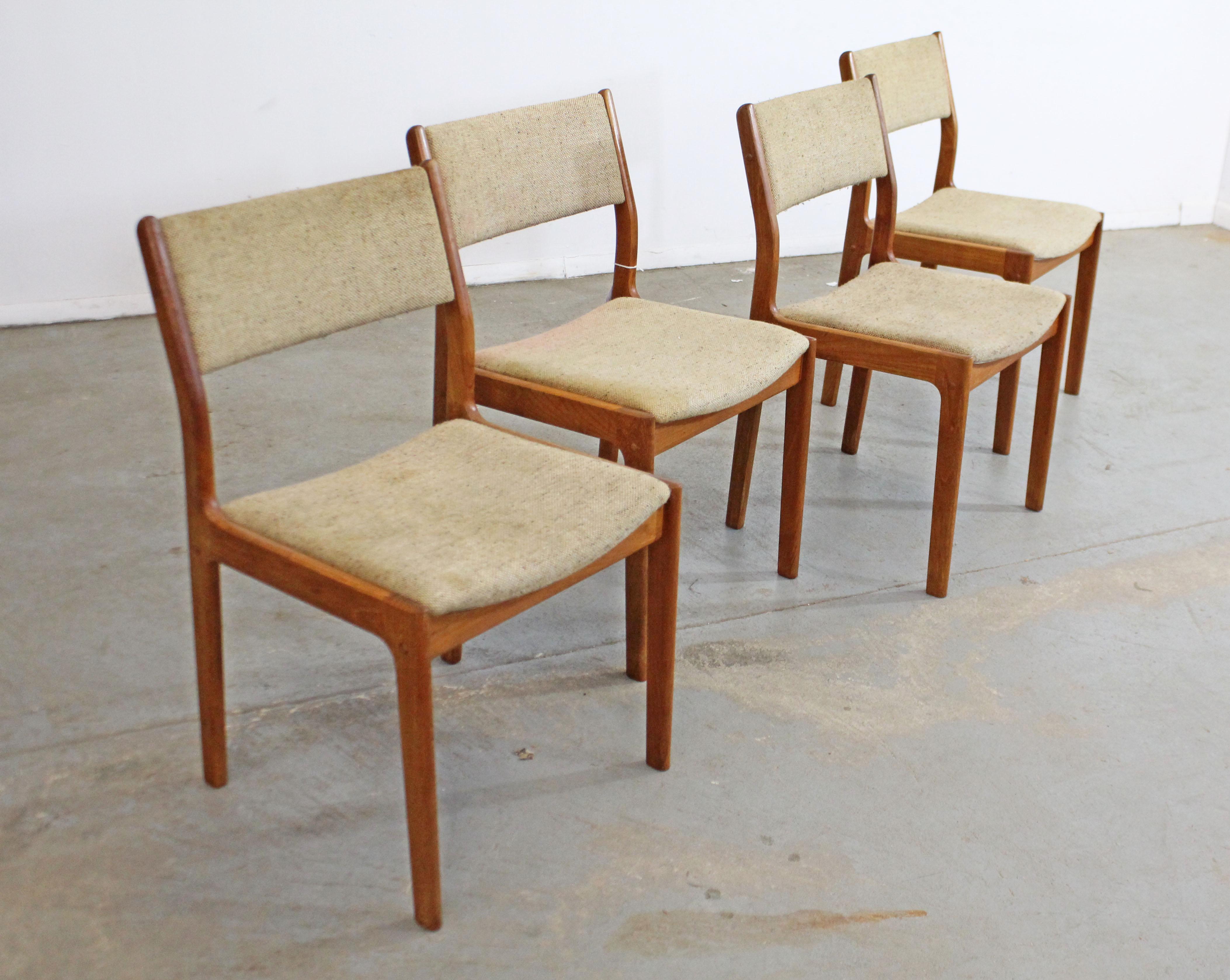 What a find. Offered is a vintage set of 4 teak side/dining chairs. This set has simple, but modern lines and could make an excellent addition to any home. They are in decent vintage condition, but can stand to be reupholstered. Has surface