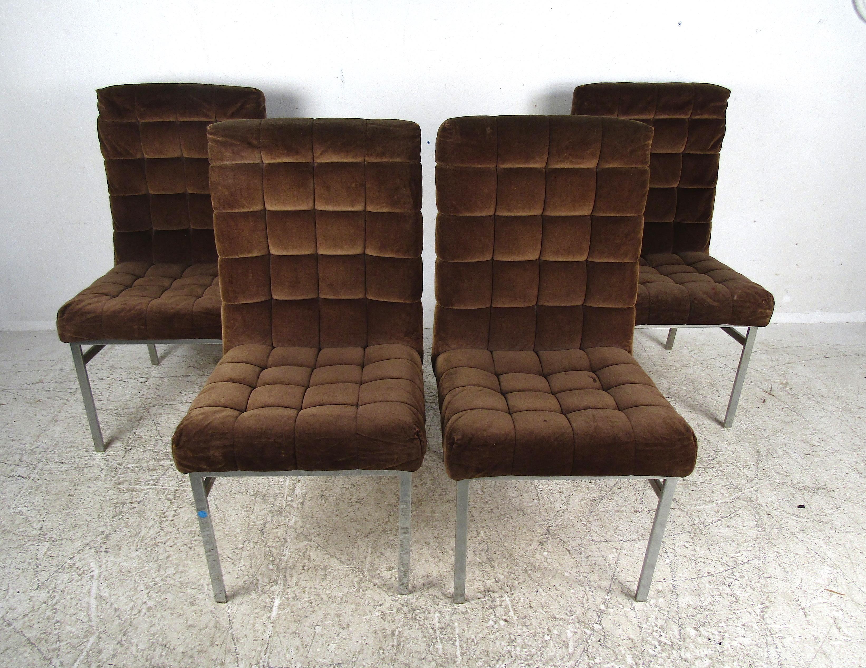 A handsome set of four midcentury dining chairs with sturdy chrome frames and a vintage brown tufted upholstery covering the seats and backrests. Please confirm the item's location with the dealer (NJ or NY).