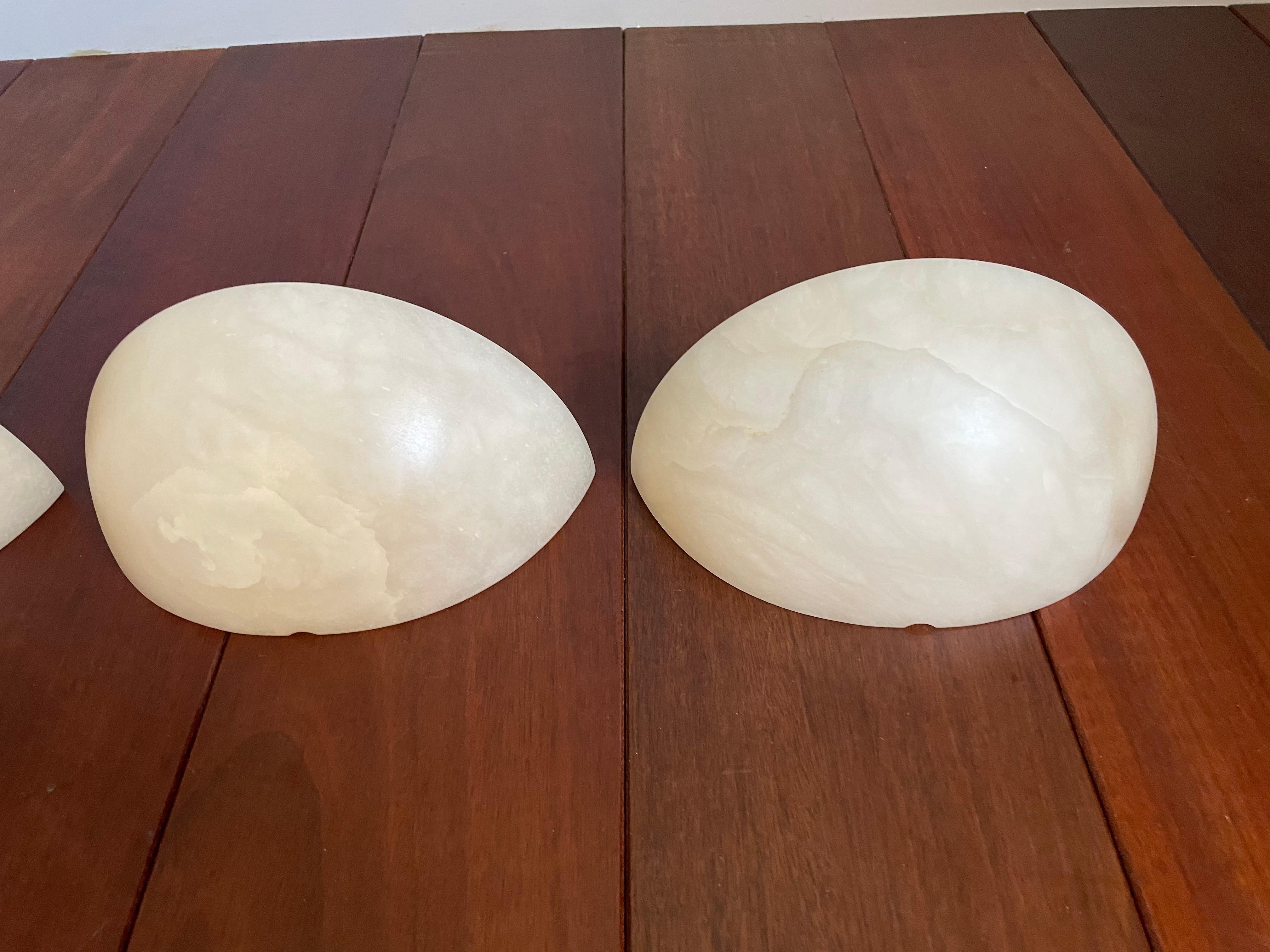 Ideal collection of 4 alabaster wall lamps for a project.

Because of their timeless designs and warm light creating qualities, we have owned and sold many alabaster light fixtures. There is something about the look and feel of these alabaster