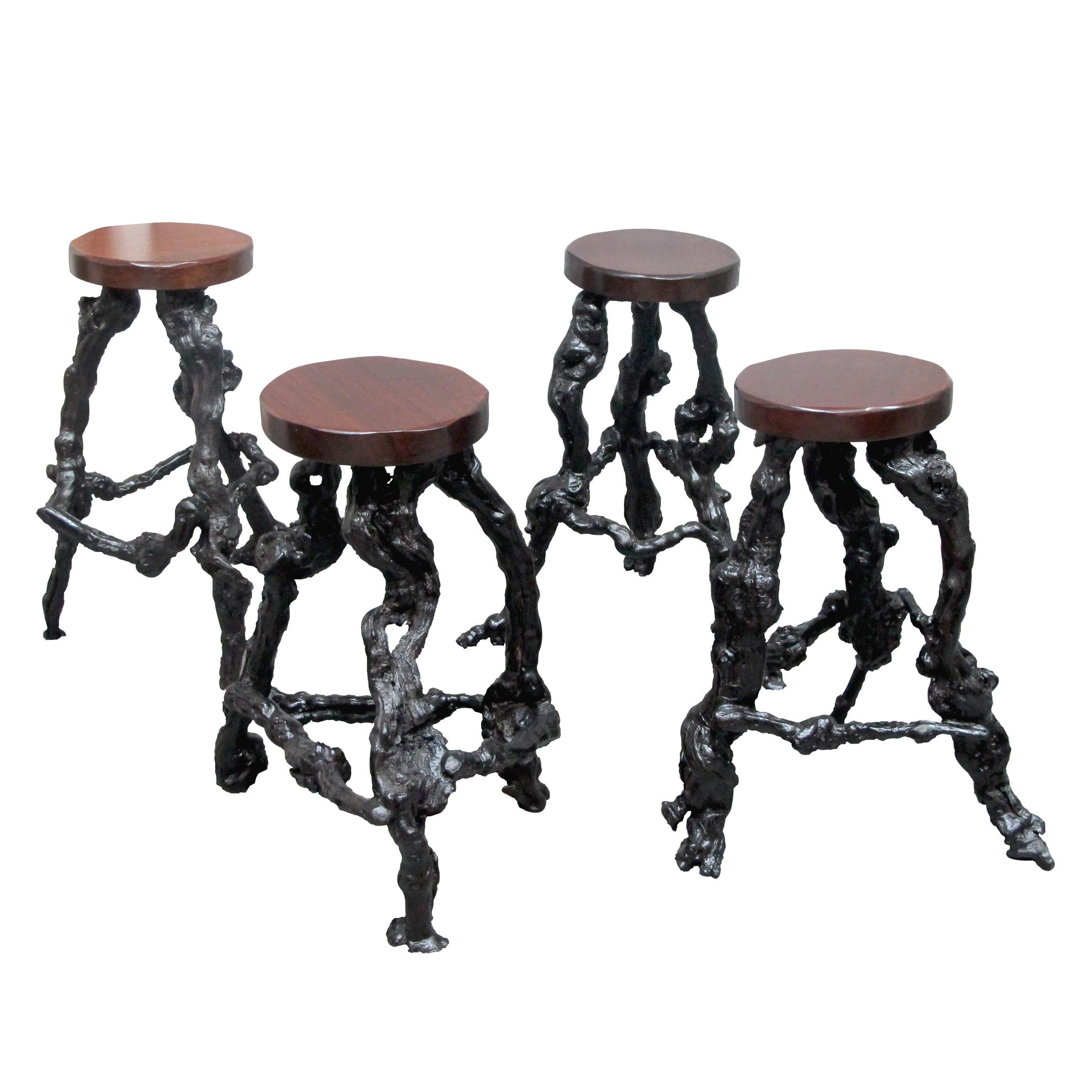 A set of 4, French, unique and unusual, midcentury organic grapevine root bar stools.. This unusual set of stools have been individually handcrafted. Their bases are made of naturally twisted vine roots which therefore means that each stool is