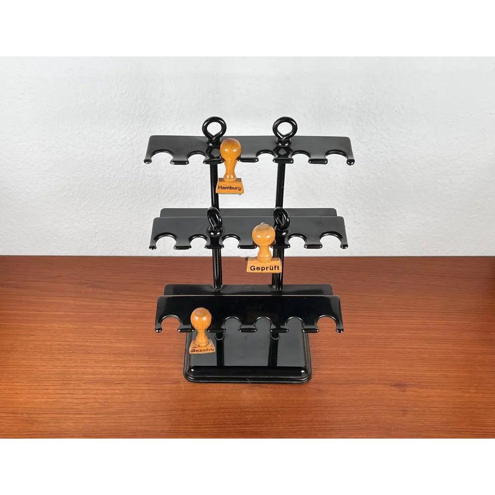 Mid-Century German Metal Office Rubber Stamp Holder and 3 Stamps, 1960s, Set of 4, in Very Good conditions. Designed 1960 to 1969.

Additional information:
Materials: Metal, Plastic
Color: Black
Styles: Industrial, Mid-Century Modern
Country of