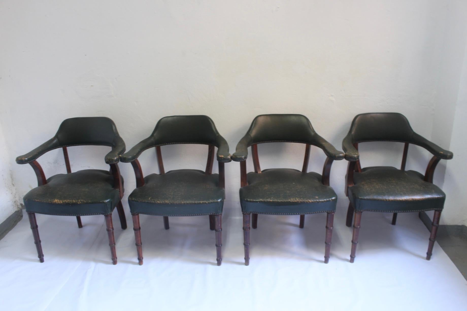 Set of 4 chairs with green leather and oakwood produced in Spain during the 1950s. With faux bamboo design at the forward legs.

 