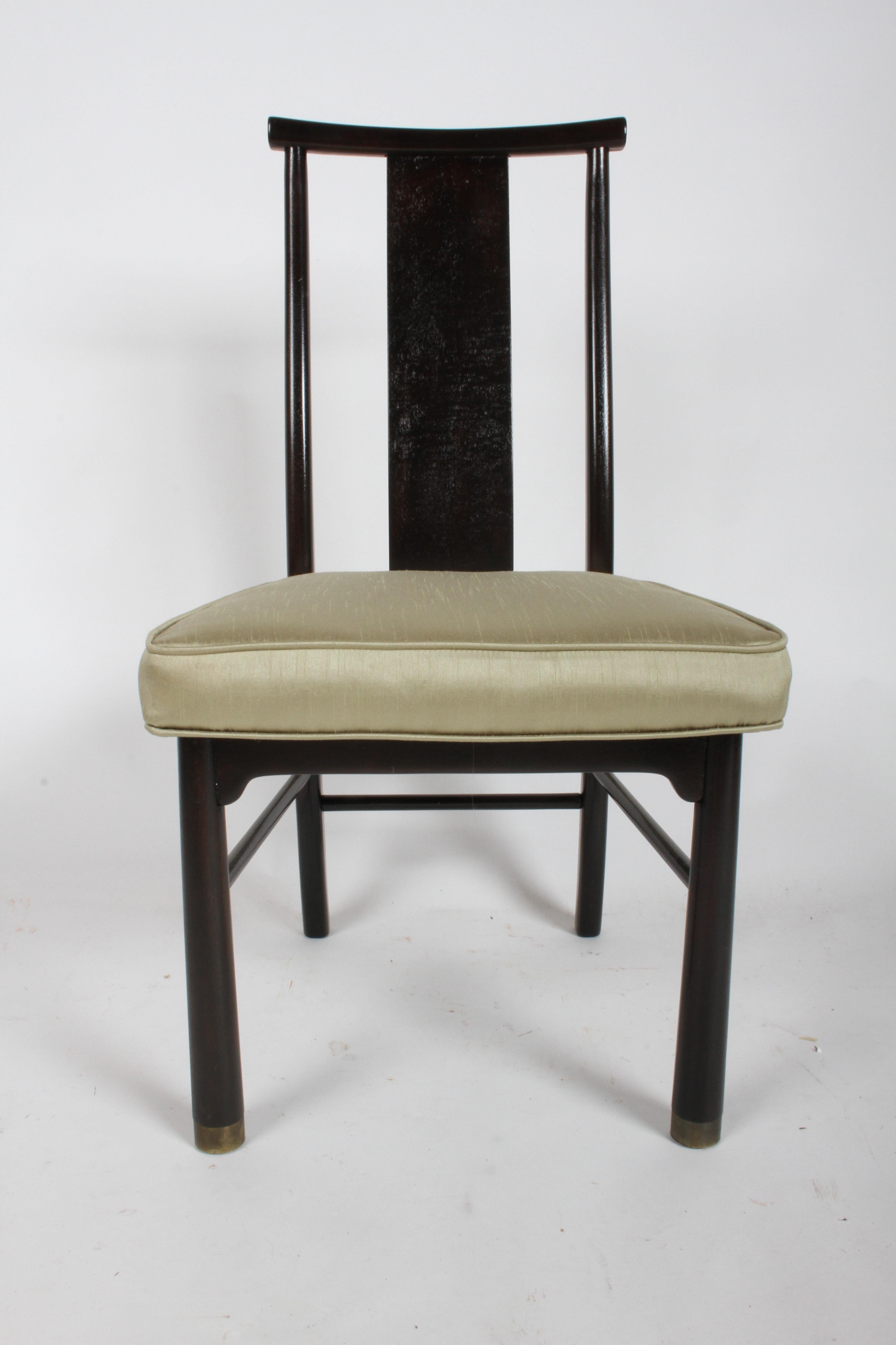 Set of four Asian Mid-Century Modern dining side chairs by Henredon. Mahogany frames refinished in dark espresso with brass sabots on front legs. Only one chair refinished, COM or I can provide a few choices of neutral upholstery from my inventory.