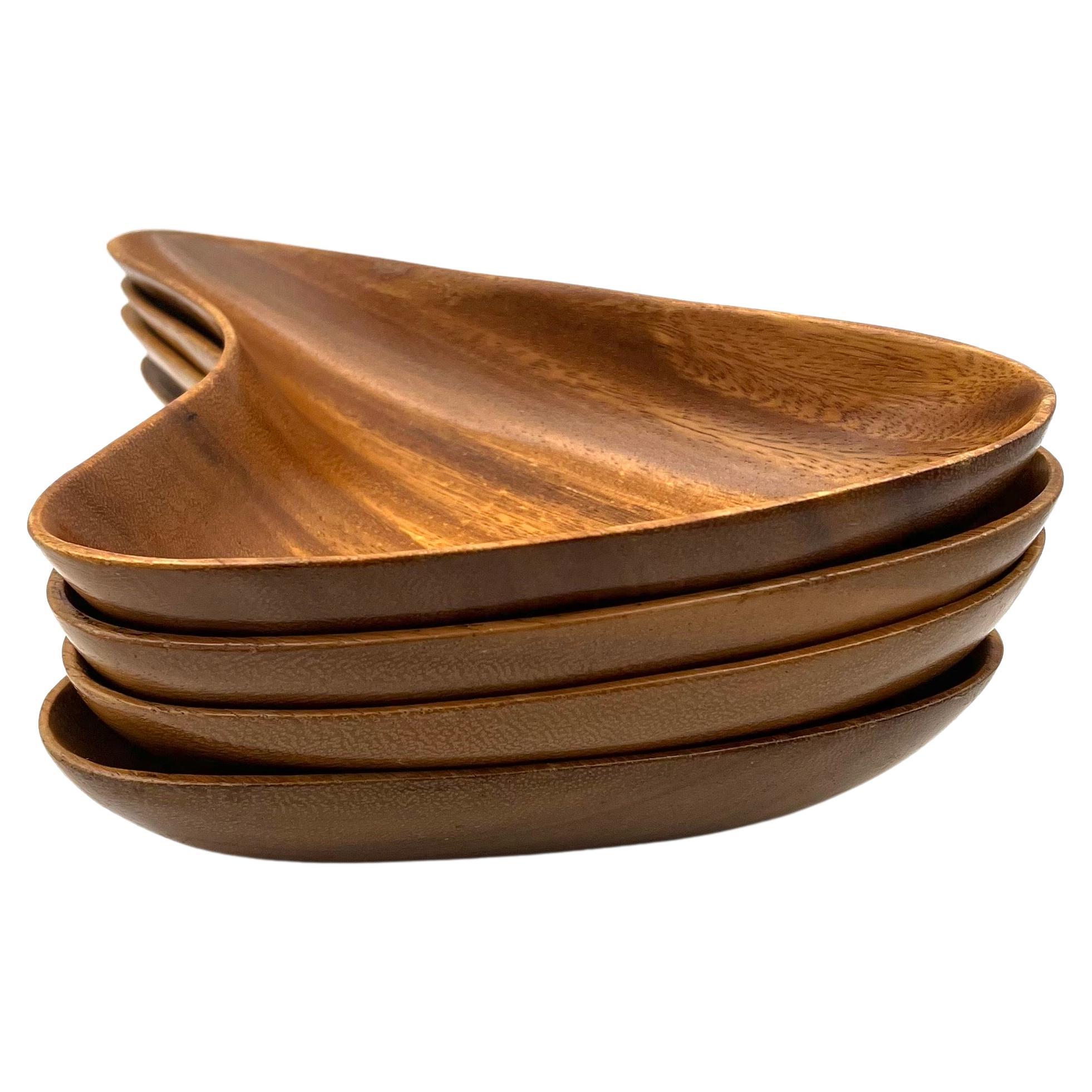 Nice set of 4 snack serving bowls in the style of Don Shoemaker. Solid palm wood versatile, and great for parties.