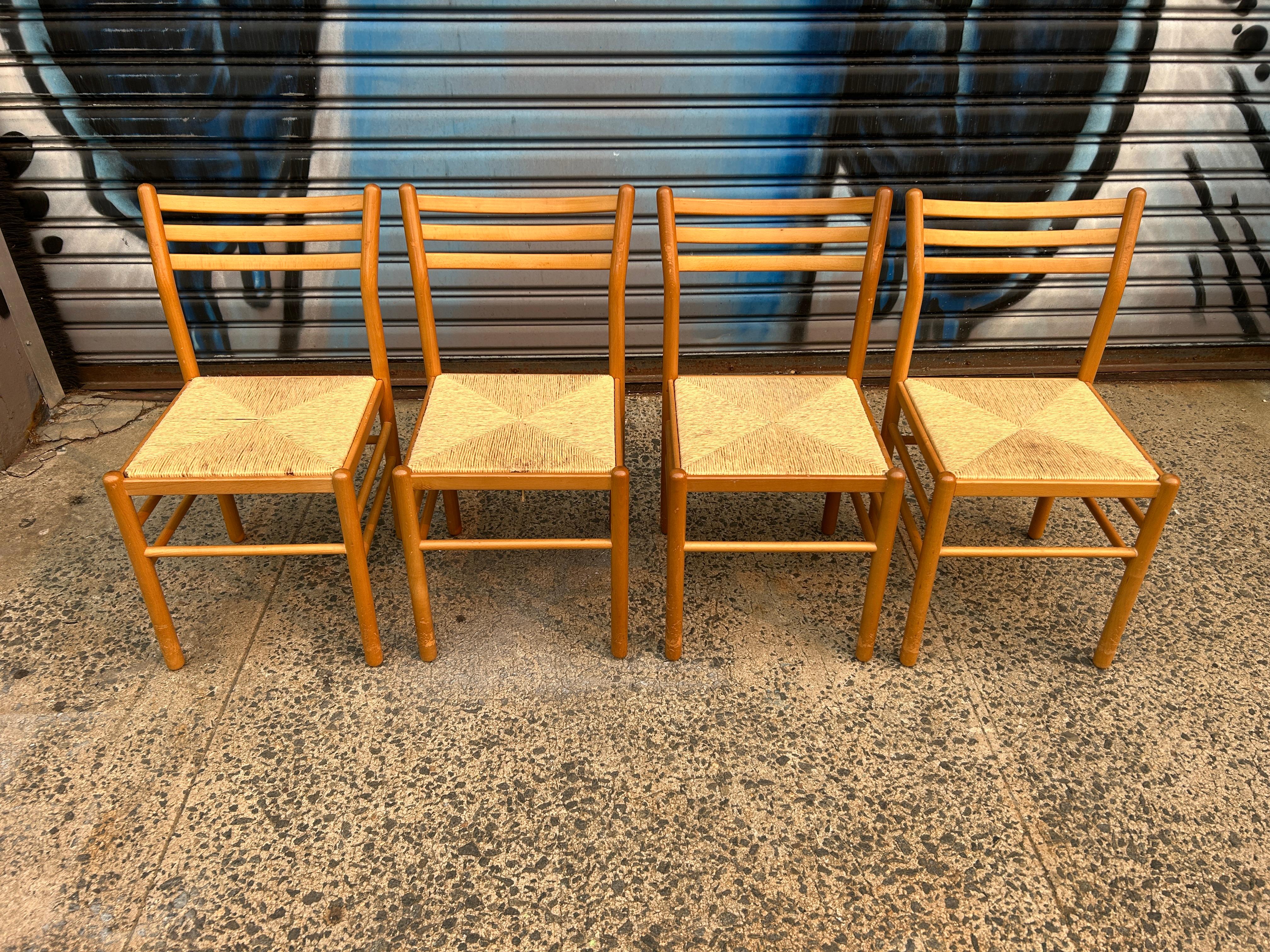 Set of 4 mid century modern birch rush dining chairs. Very simple dining chairs solid birch wood with rush seats. Minimalist design dining chairs. Made in Denmark. Located in Brooklyn NYC.

This listing is for (1) set of (4) chairs.