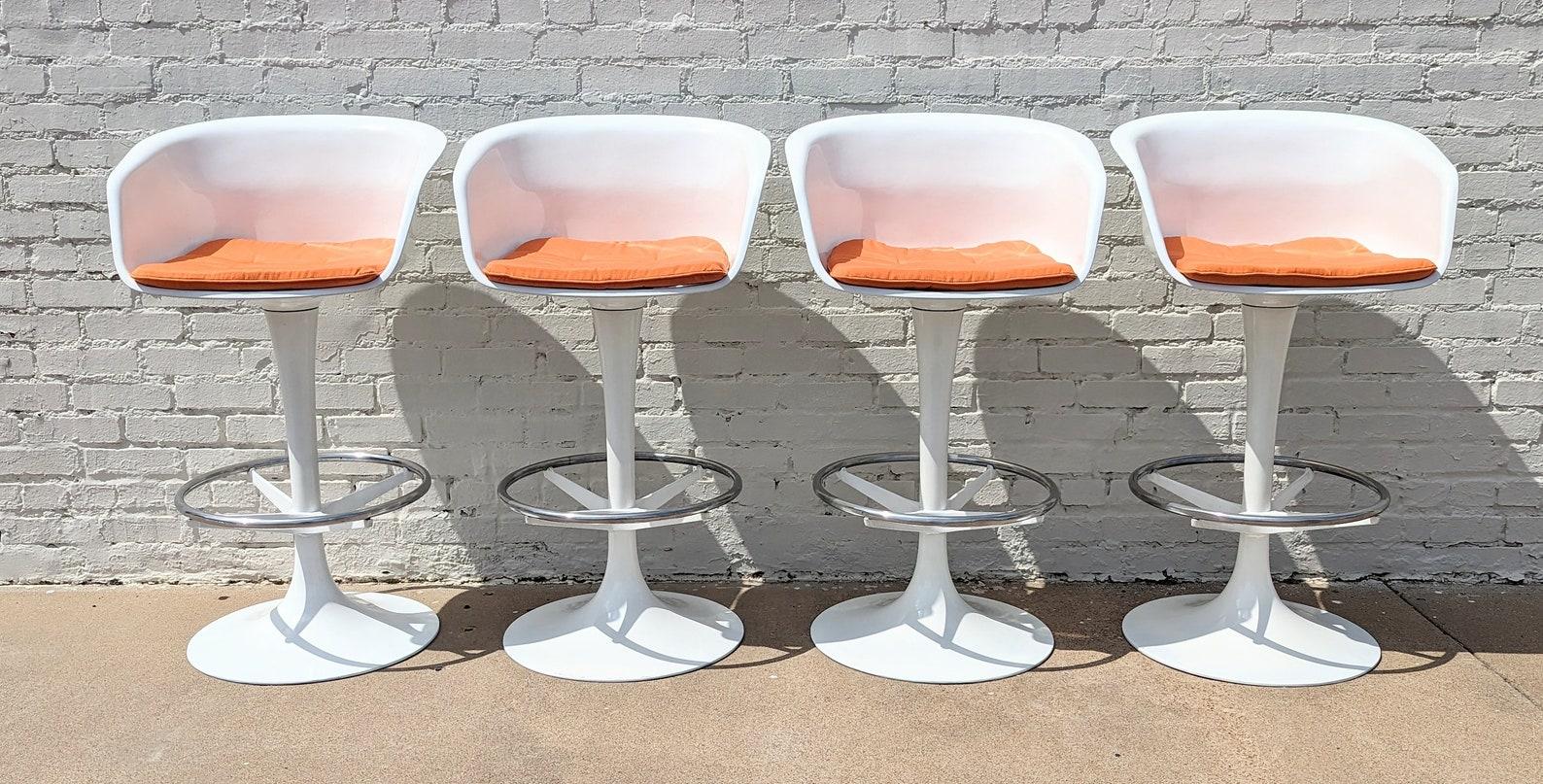 Mid Century Modern Burke Tulip Barstools

Above average vintage condition and structurally sound. Has some expected slight finish wear and scratching. Swivel works smoothly on all chairs. Chairs have been recovered recently and done professionally