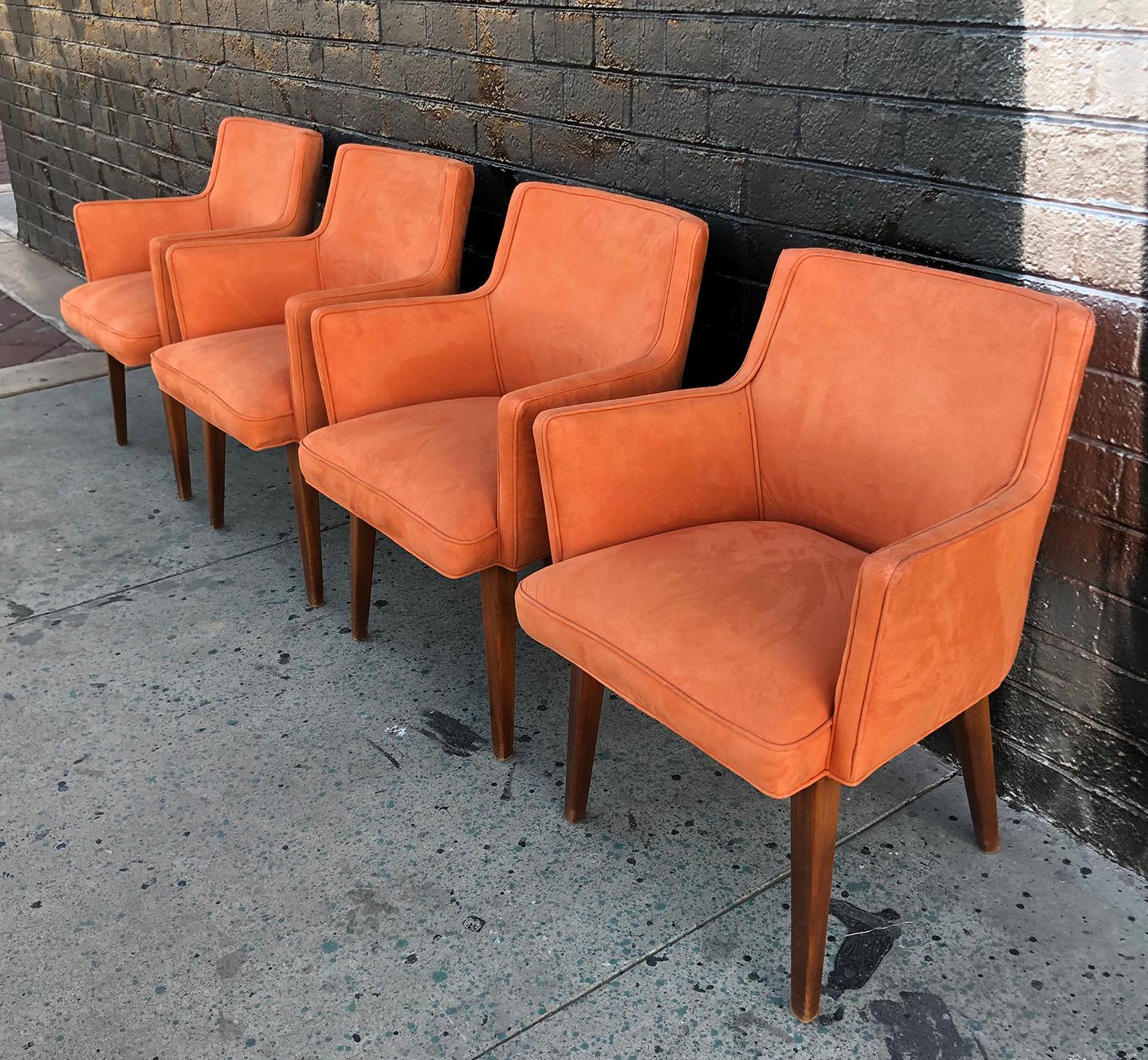 Available right now we have a gorgeous set of 4 Mid-Century Modern dining chairs upholstered in an orange microsuede type material. These cute mid mod chairs have a very Paul McCobb meets Saarinen feel and are in great condition with minimal wear