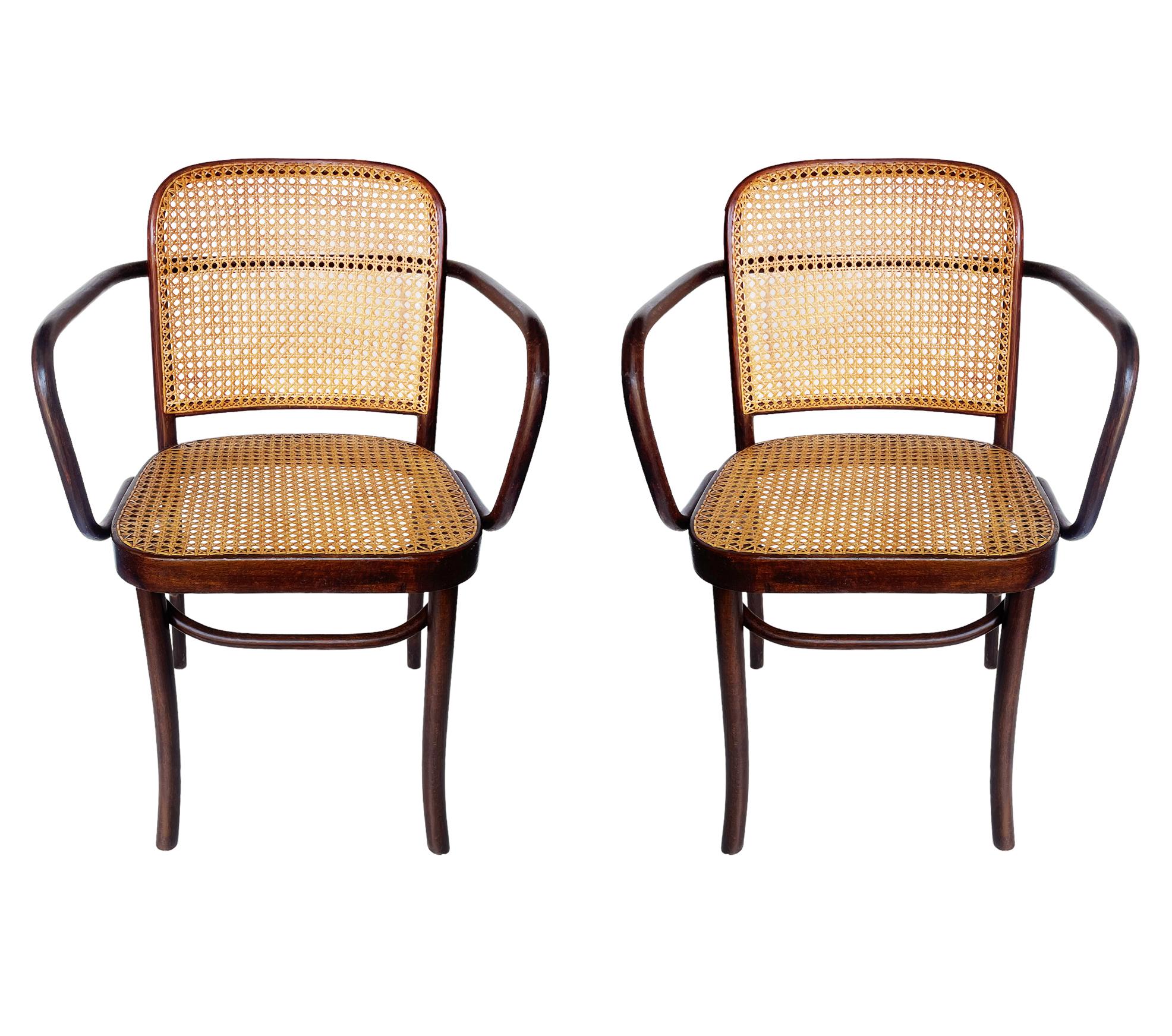 A complete set of four Josef Hoffmann bentwood Prague chairs in dark stained birch. The caning on these were most likely done at some point and looks great. Beautiful set of chairs and ready to use. Made in Czech, circa 1960s.