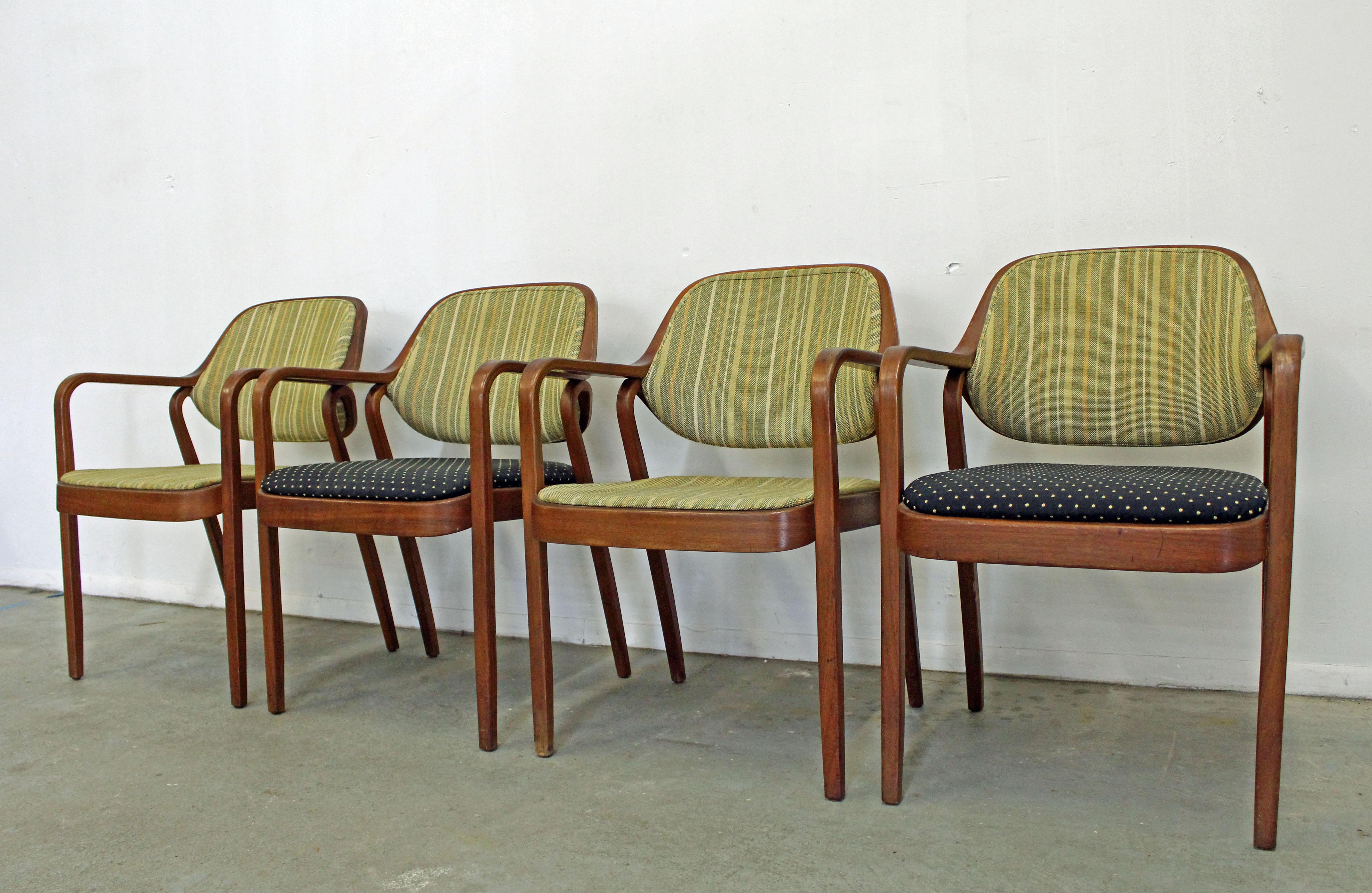 What a find. Offered is a set of 4 dining arm chairs designed by Don Pettit for Knoll International. The chairs are structurally sound, in decent condition with cosmetic age wear. They have some surface scratches and age wear on the upholstery (see