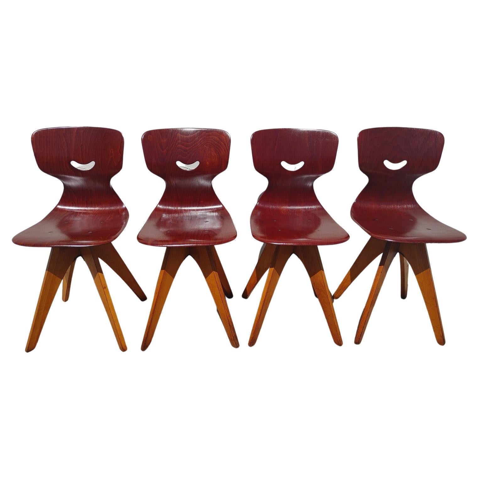 Set of 4 Mid Century Modern German Bentwood Chairs

Above average vintage condition and structurally sound. Has some expected slight finish wear and scratching. Seats and backs are in above average condition, legs have some finish wear and dings.